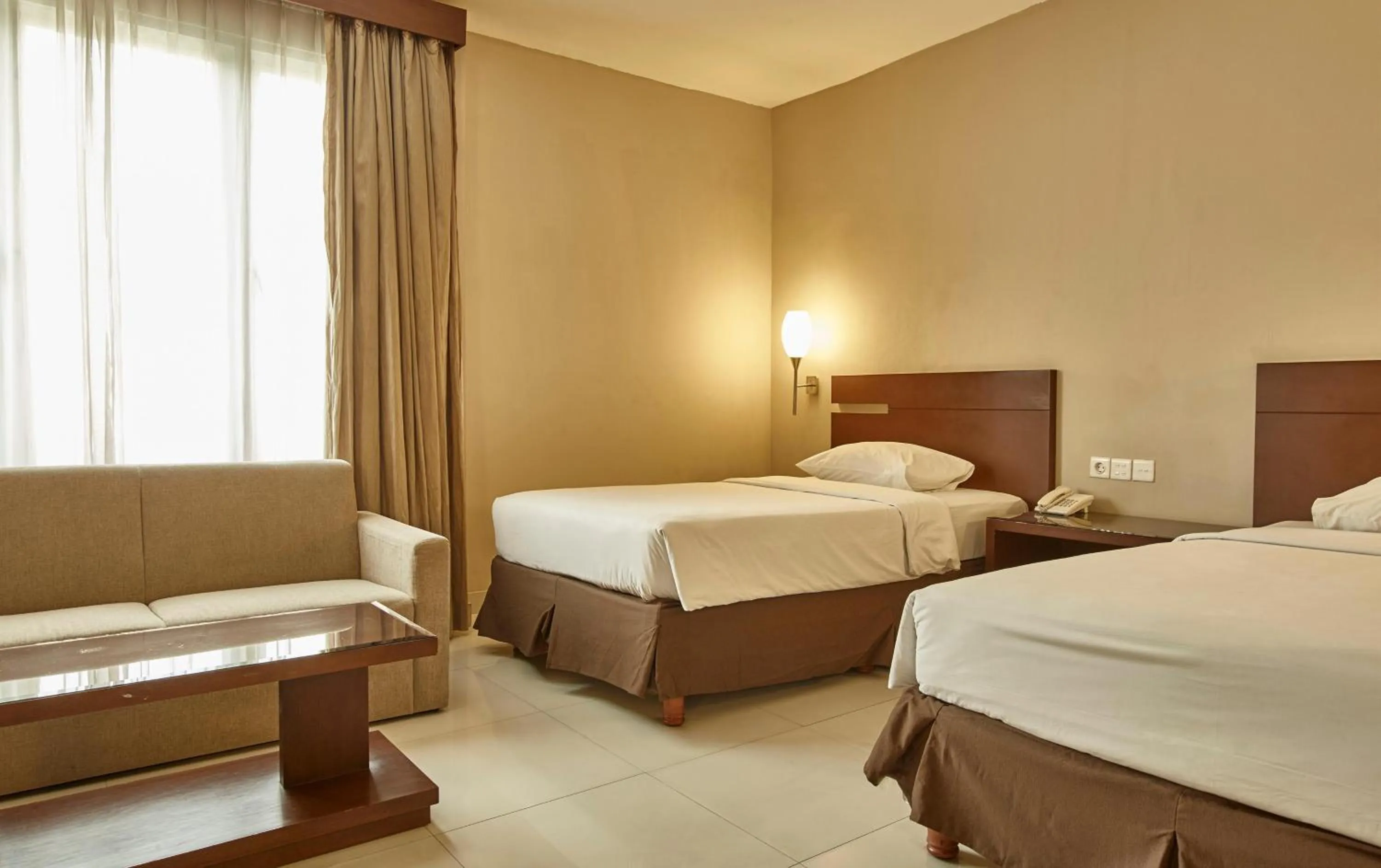 Bedroom, Bed in Triniti Hotel Gajah Mada