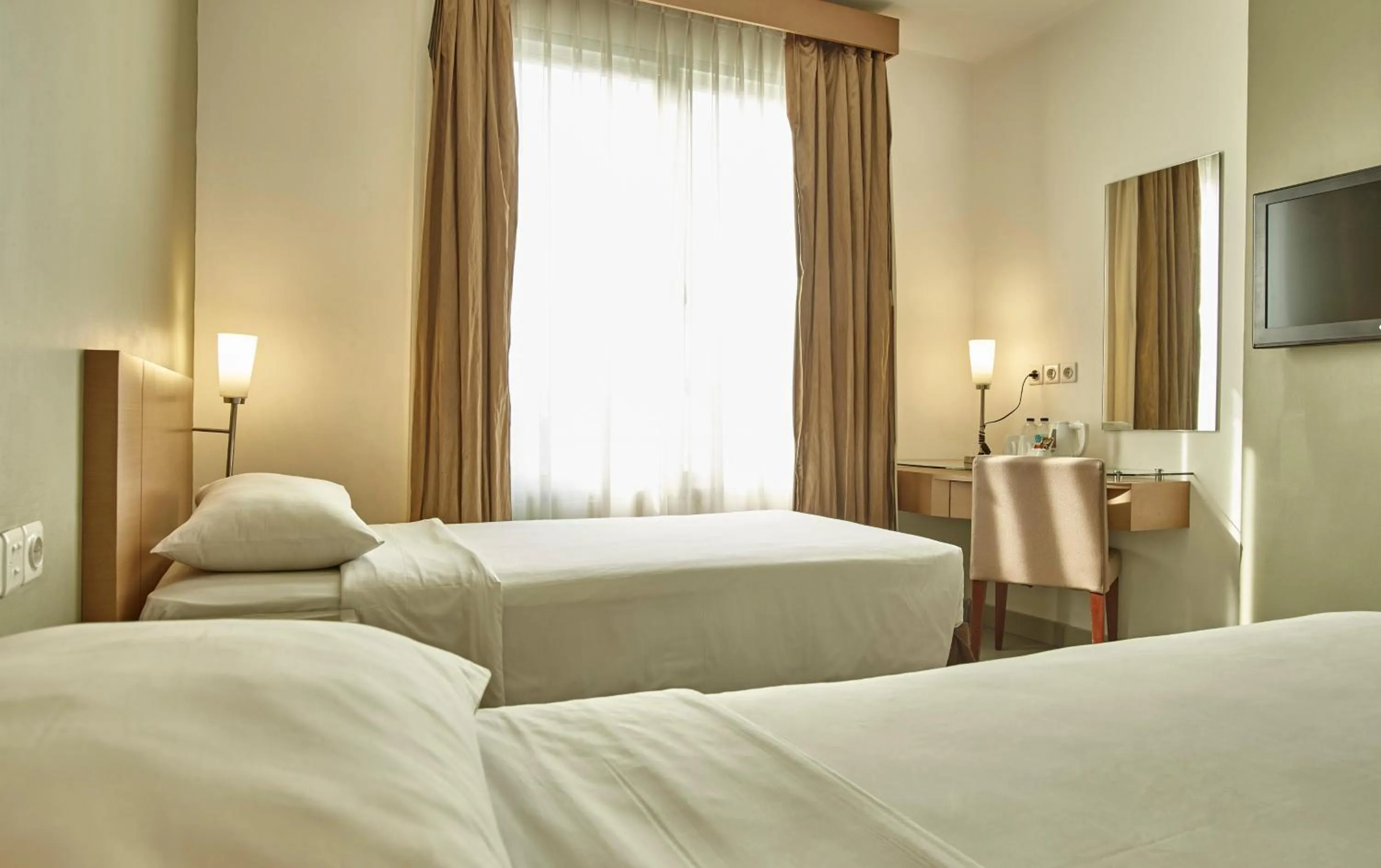 Bedroom, Bed in Triniti Hotel Gajah Mada