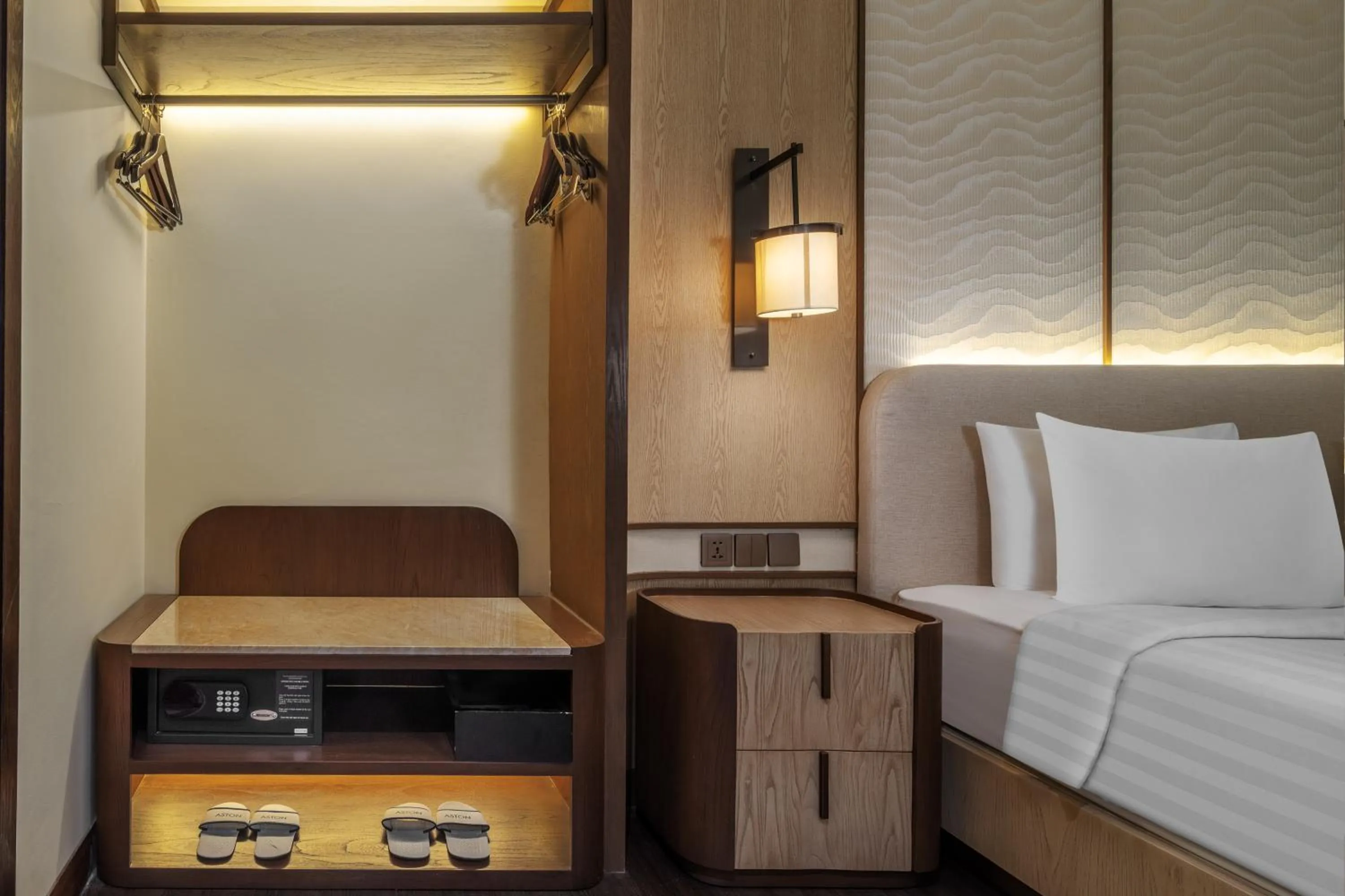 wardrobe, Bed in Aston Kuta Hotel and Residence