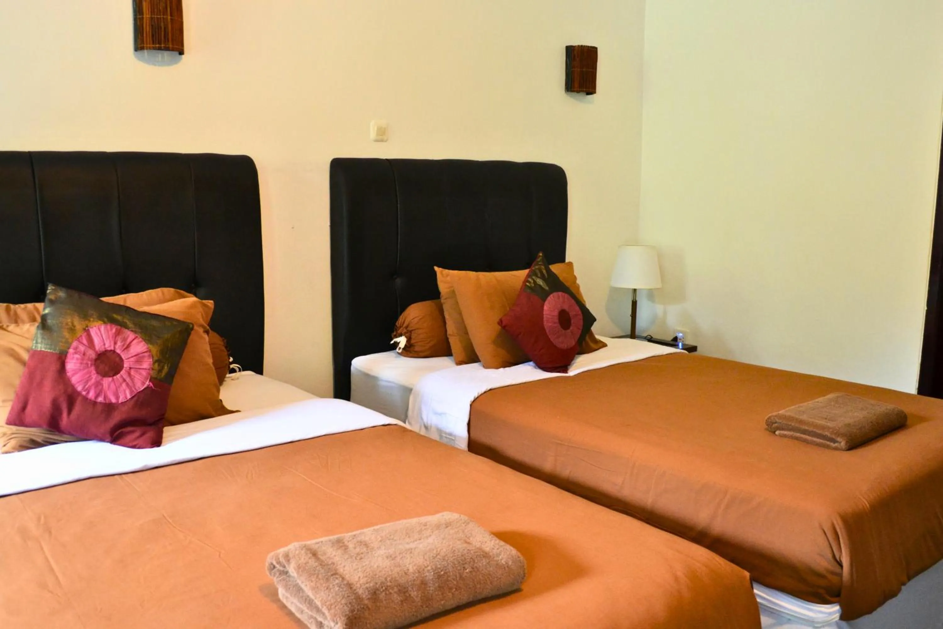 Bed in Absolute Scuba Bali Dive Resort