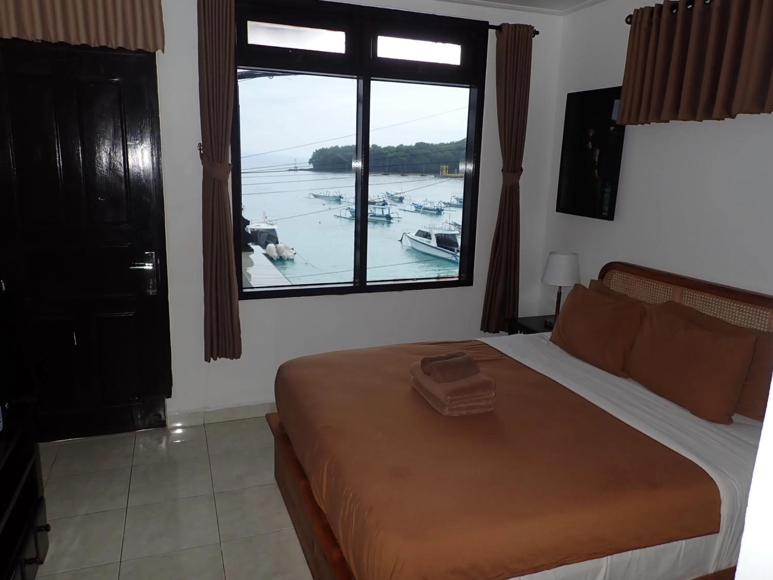 Bed in Absolute Scuba Bali Dive Resort