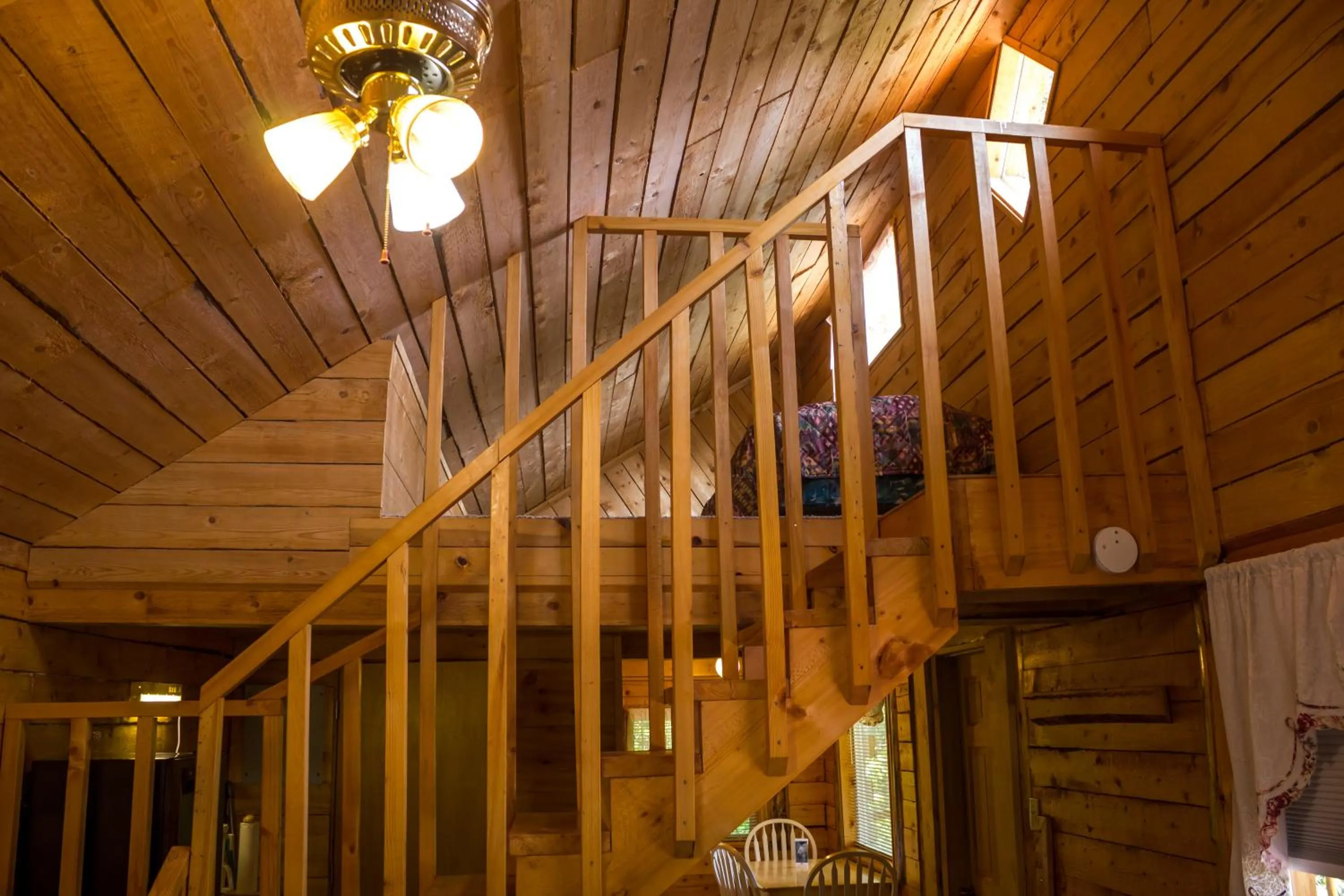 Bed in Midnight Sun Log Cabins