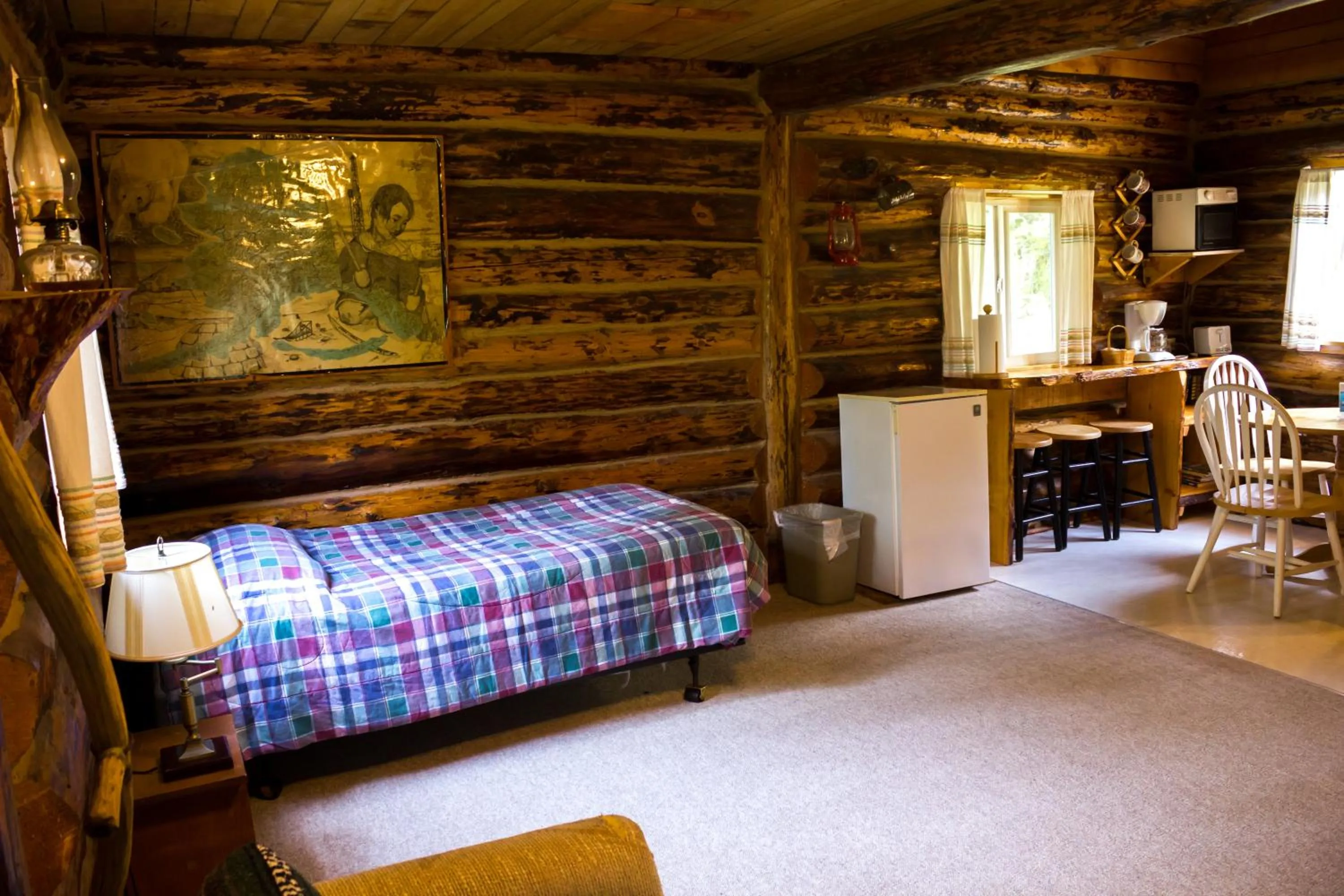 Bed in Midnight Sun Log Cabins