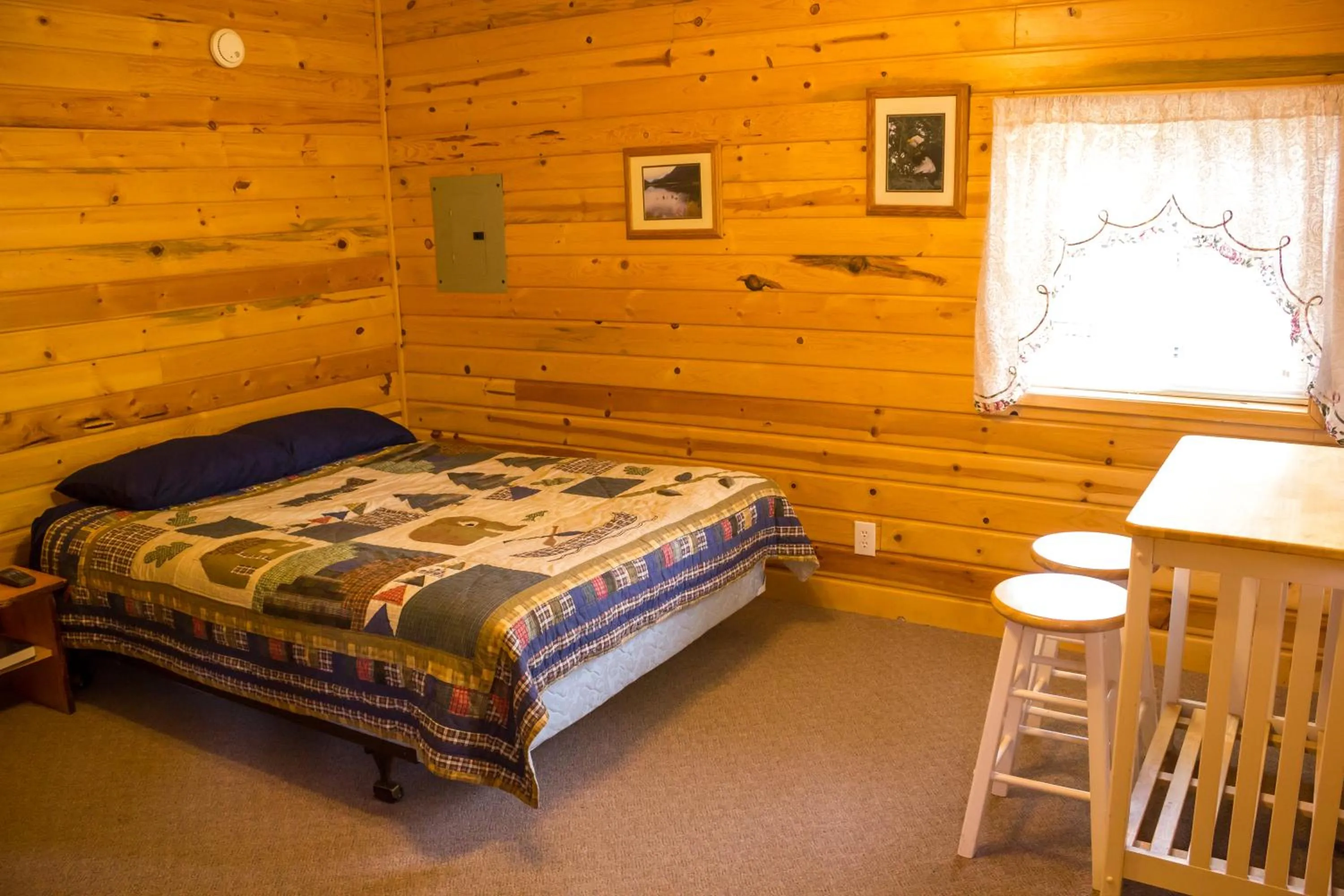 Bed in Midnight Sun Log Cabins