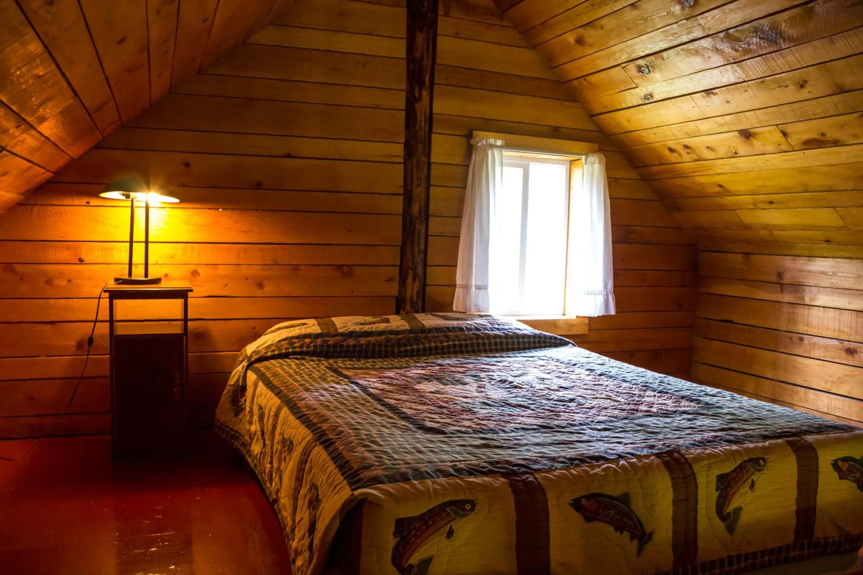 Bed in Midnight Sun Log Cabins