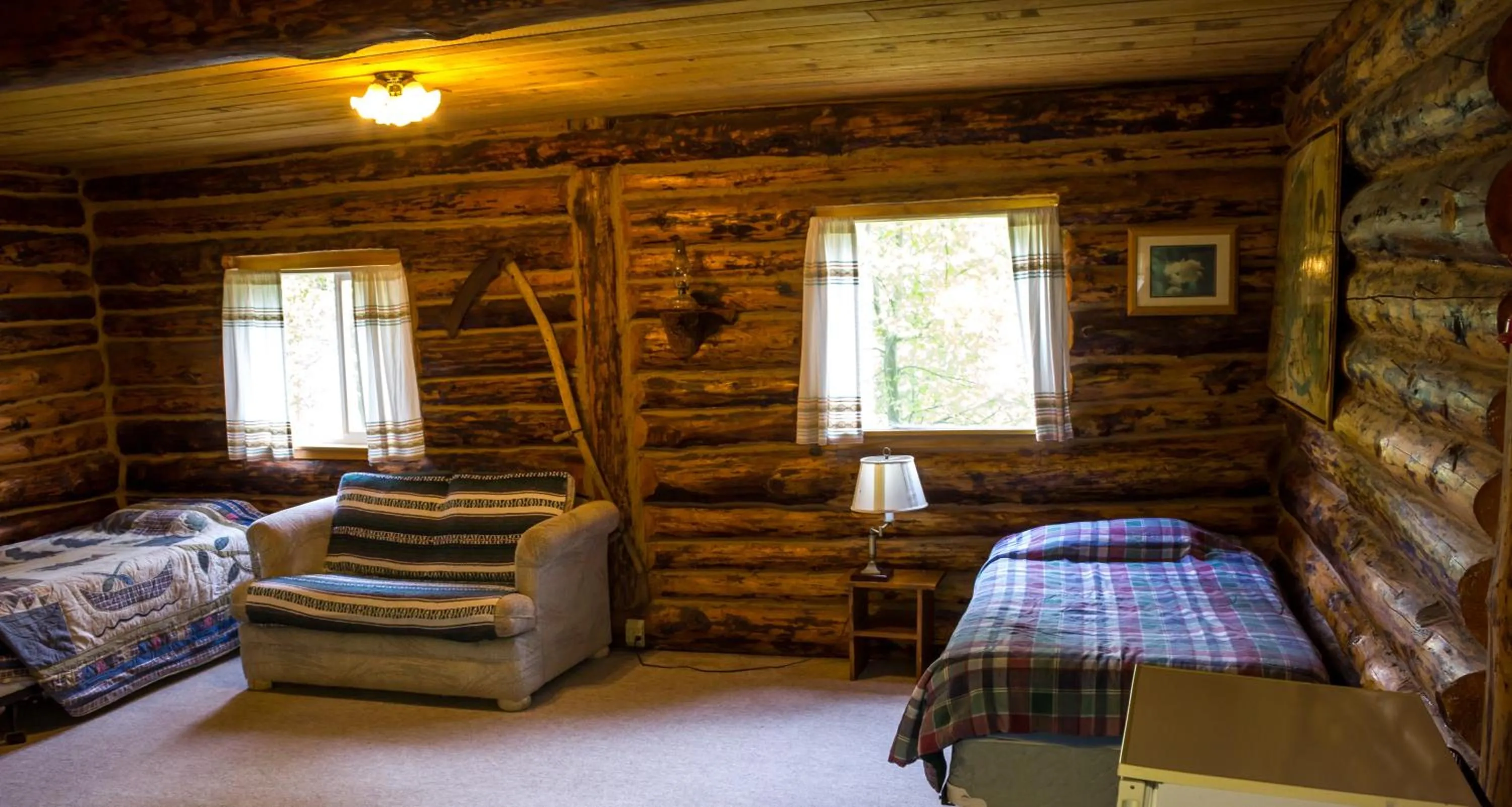 Bed in Midnight Sun Log Cabins