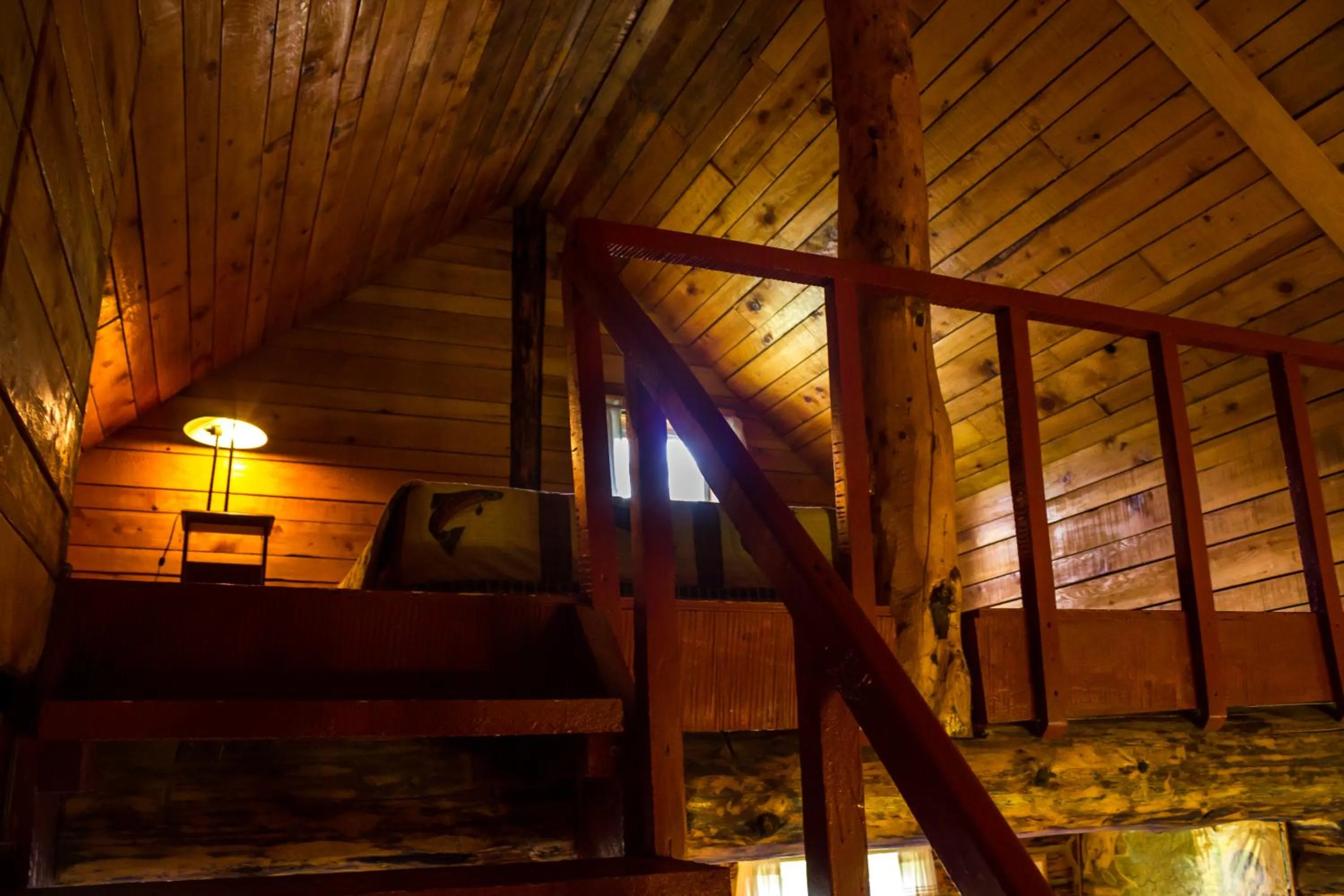 Bed in Midnight Sun Log Cabins