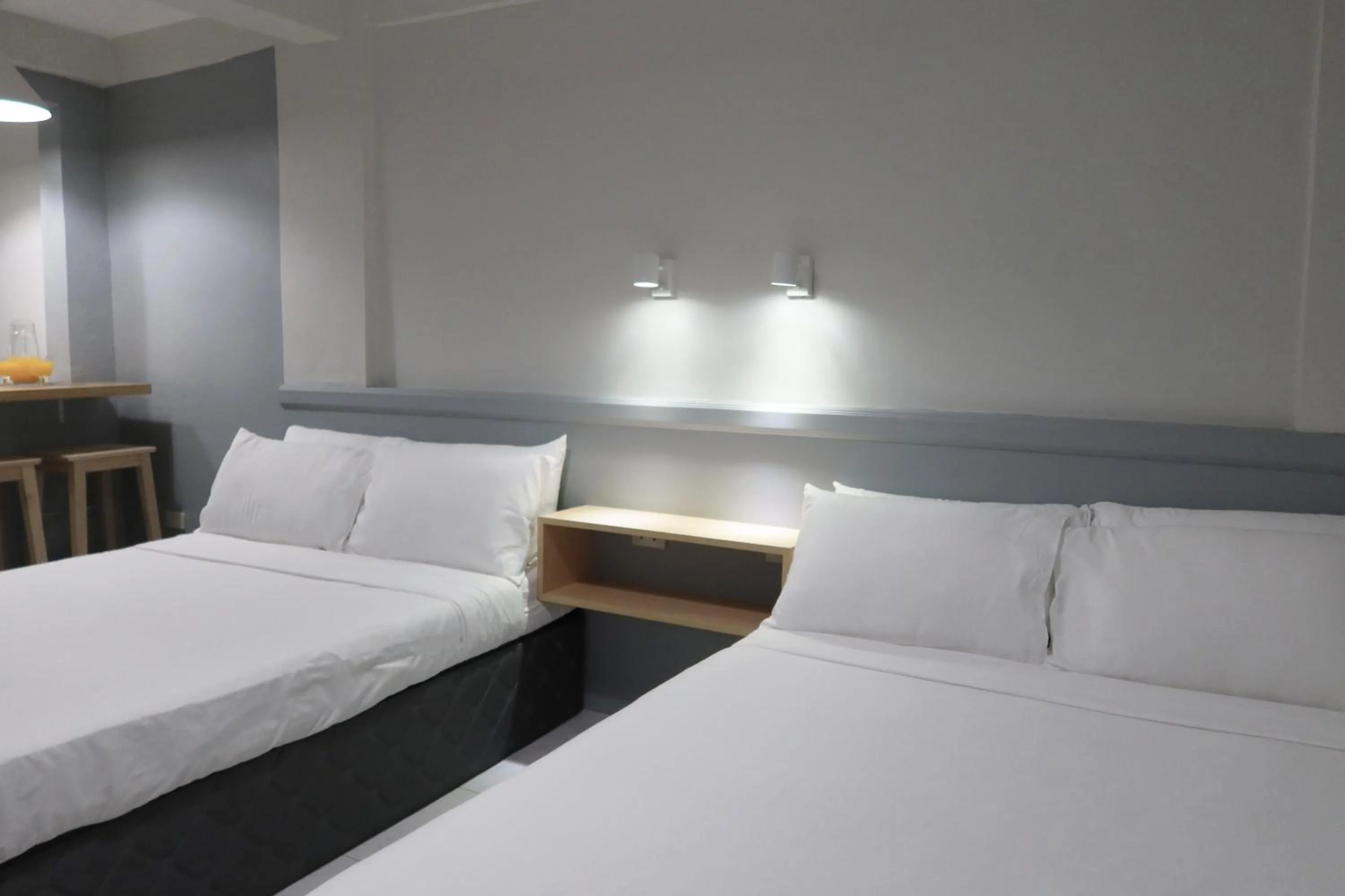 Bed in Dragonfly Apartments and Transient House