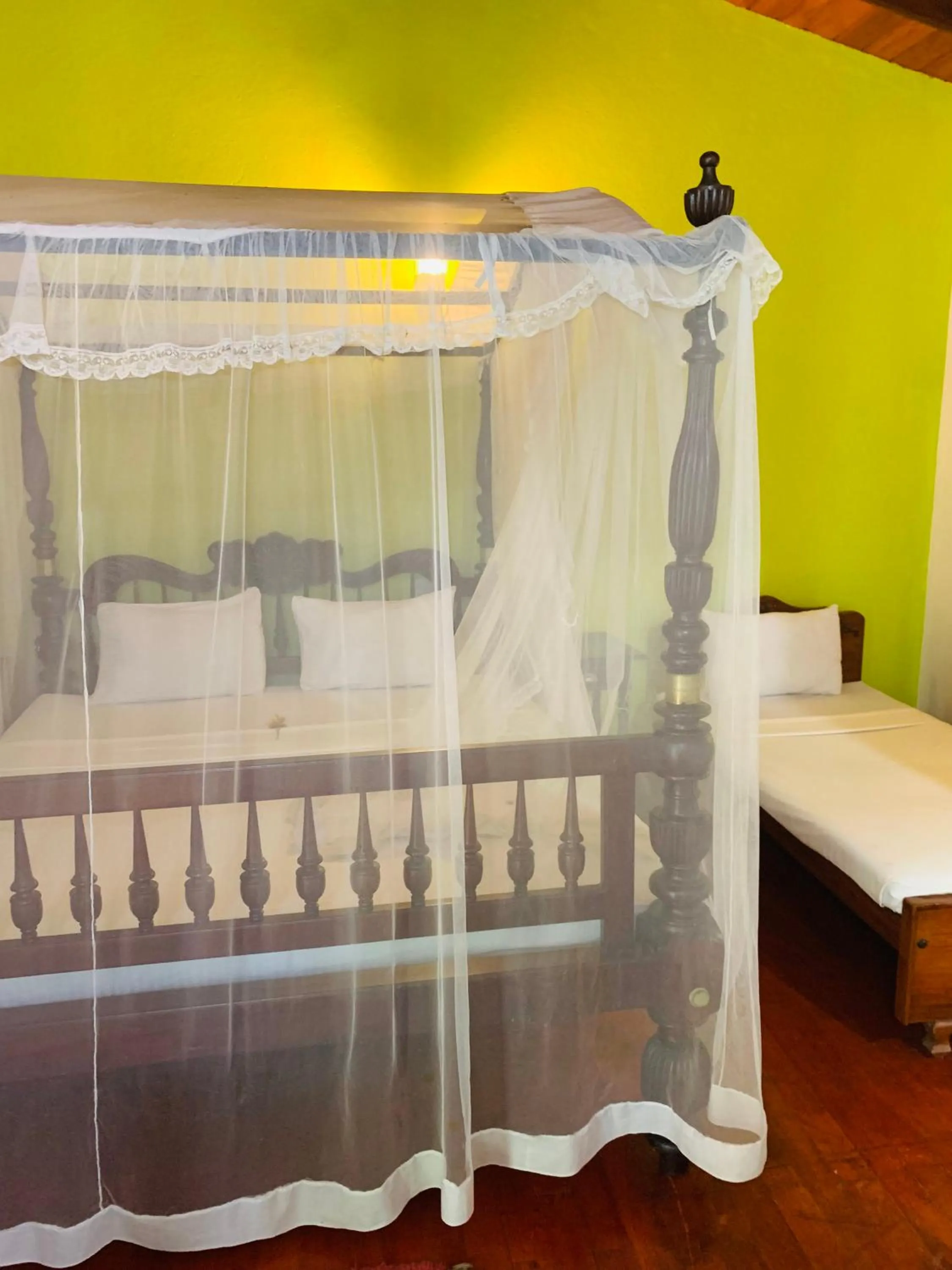 Bed in Hareesha Holiday Resort