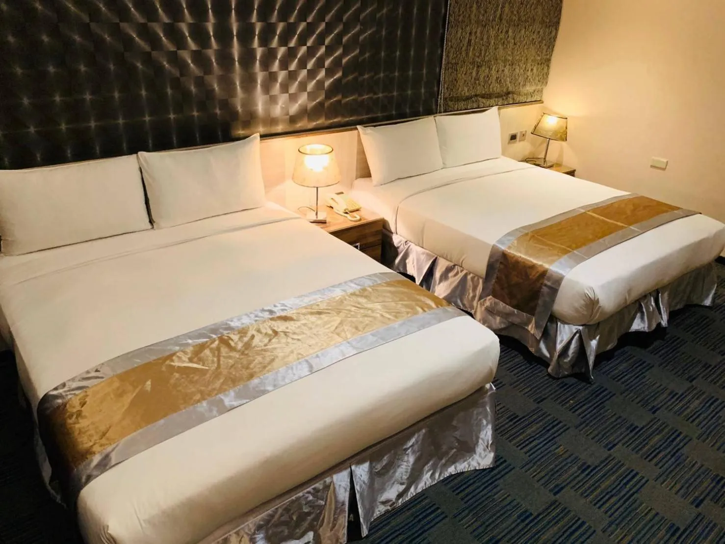 Bed in Kaishen Sinsu Hotel