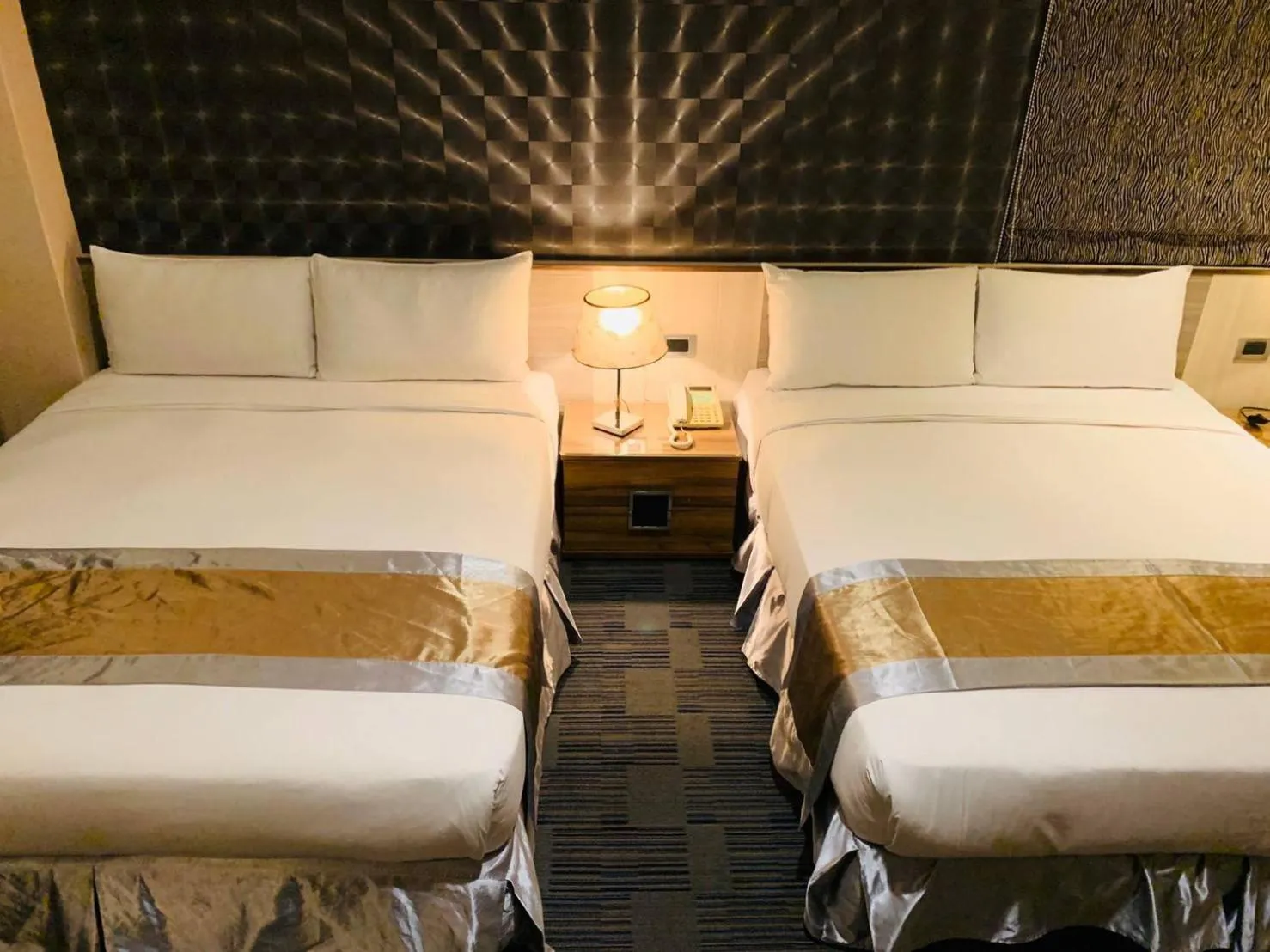 Bed in Kaishen Sinsu Hotel