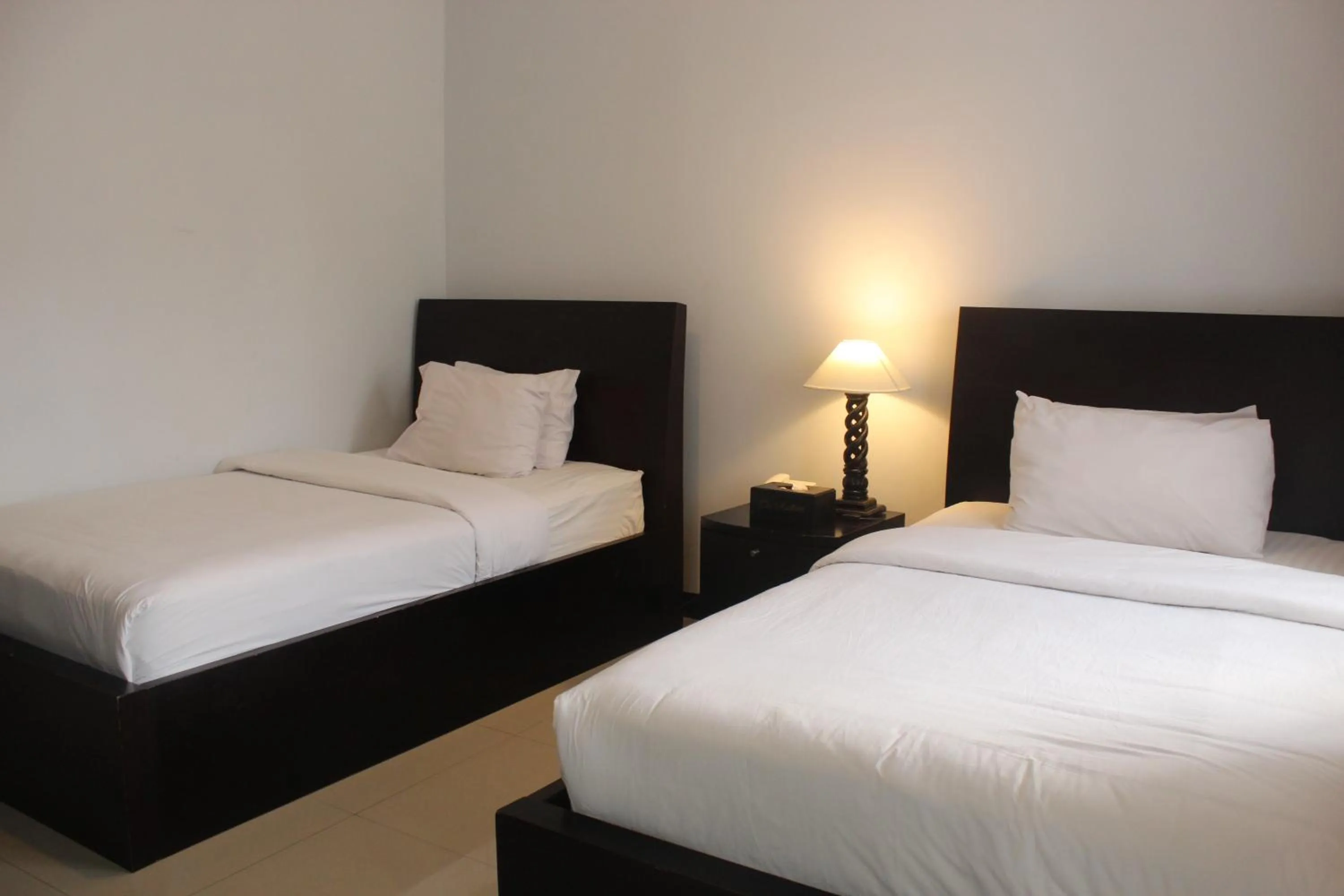 Bed in The Radiant Hotel