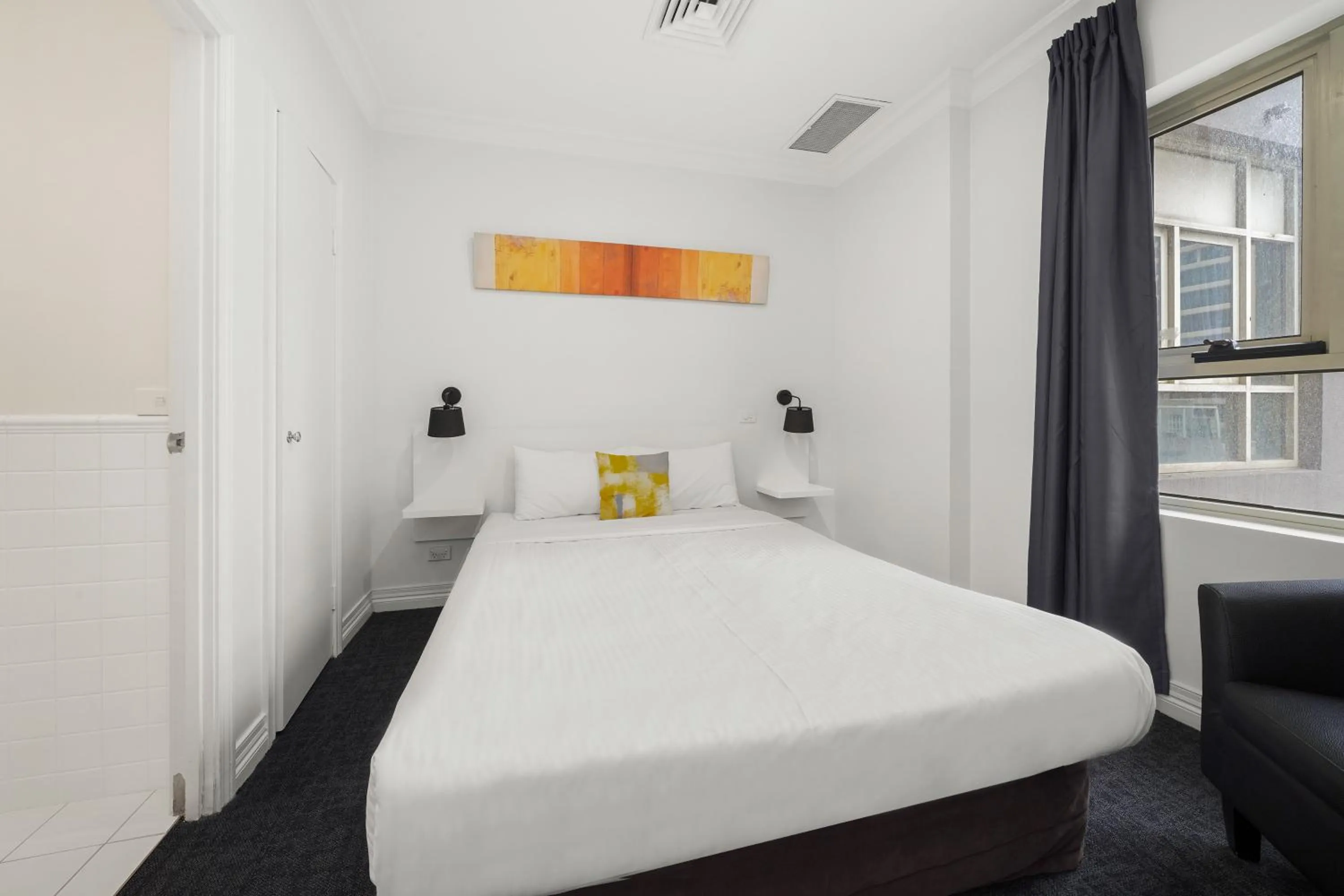 Bed in Comfort Apartments Melbourne Central