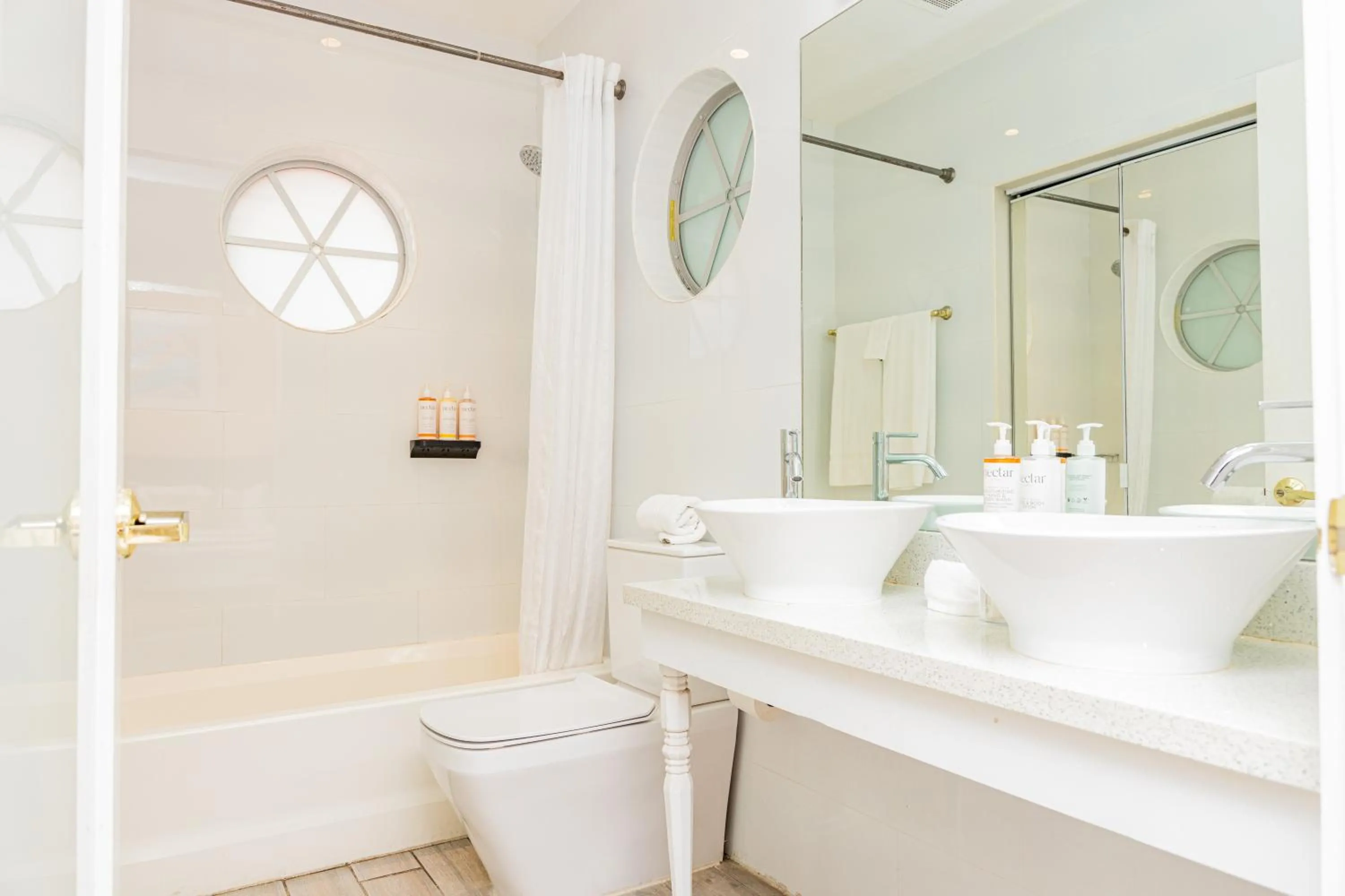 Toilet in Oceanside Hotel and Suites