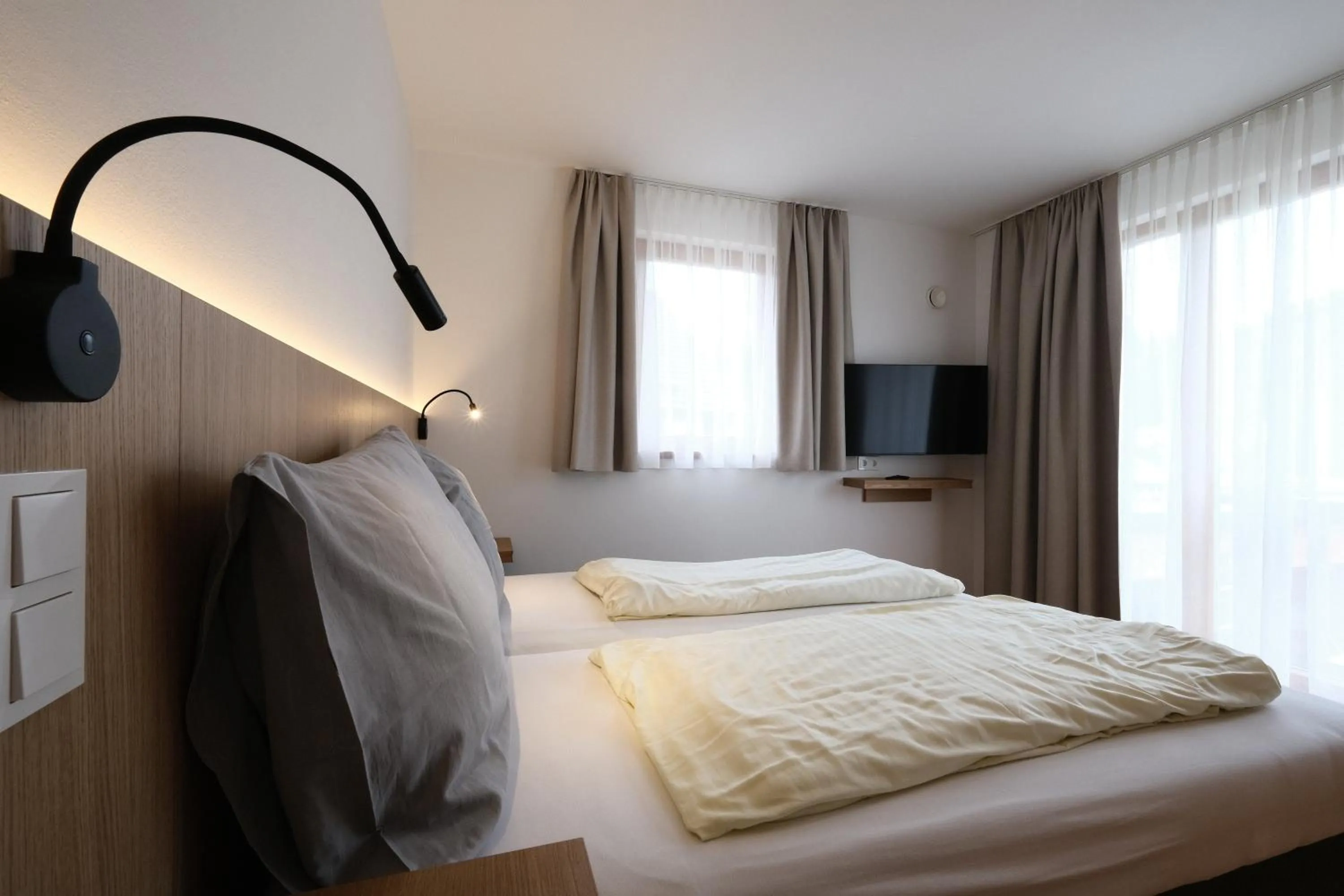 Bedroom, Bed in SeeHotel & SeeApartments Kärntnerhof- direkt am See!