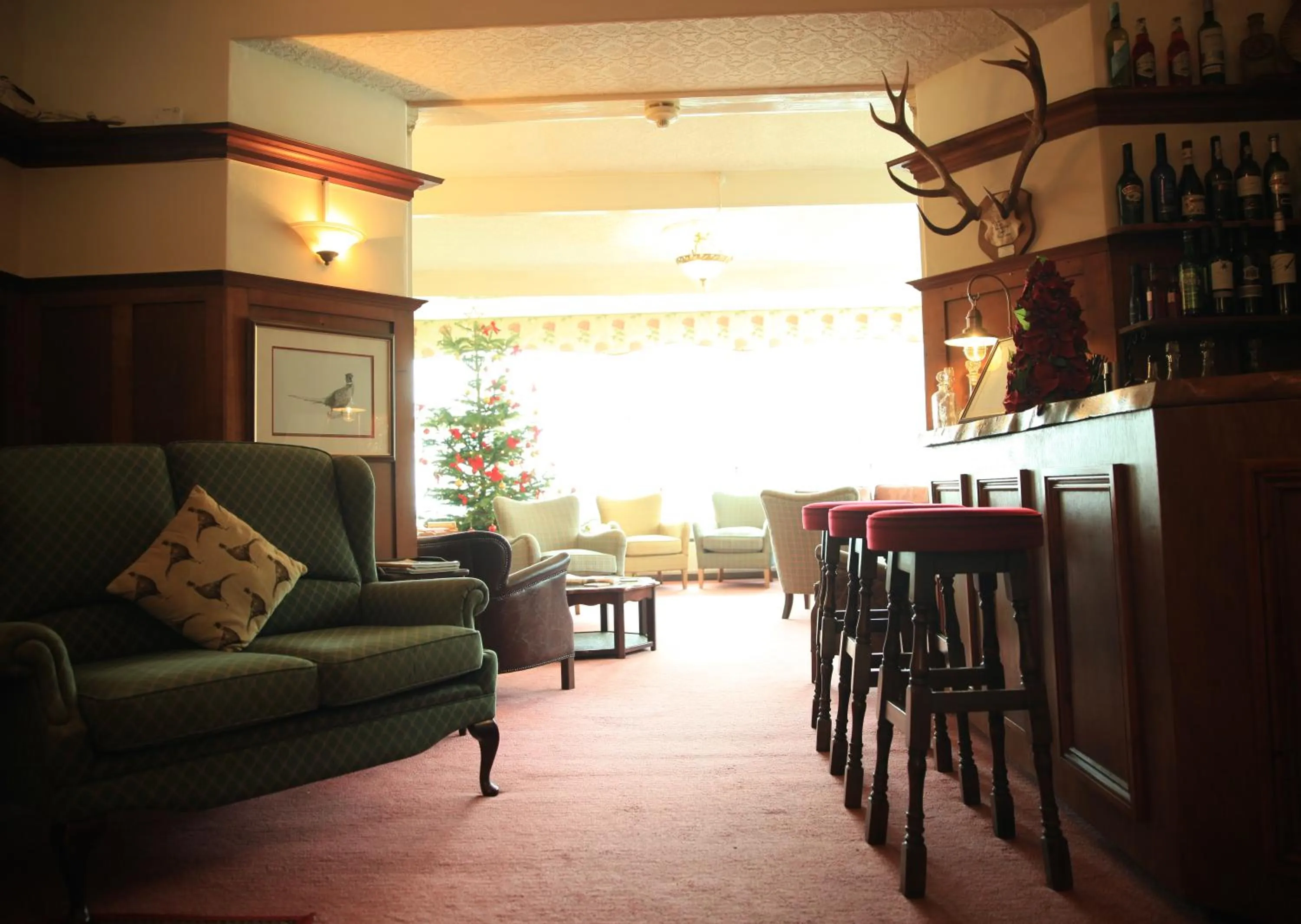 Communal lounge/ TV room in The Bonnicott Hotel Lynmouth