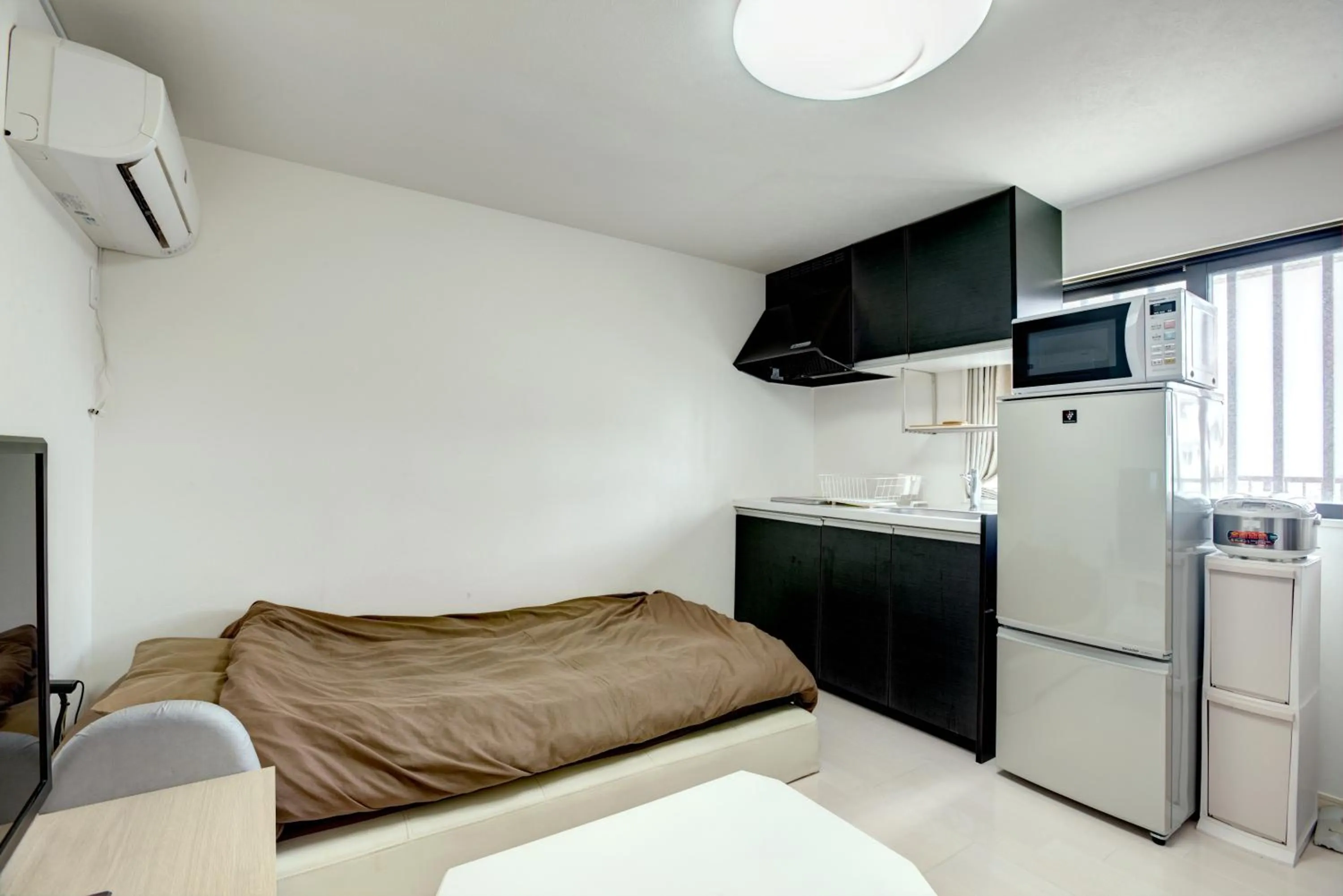 Bed in Terrace Resort Ginowan