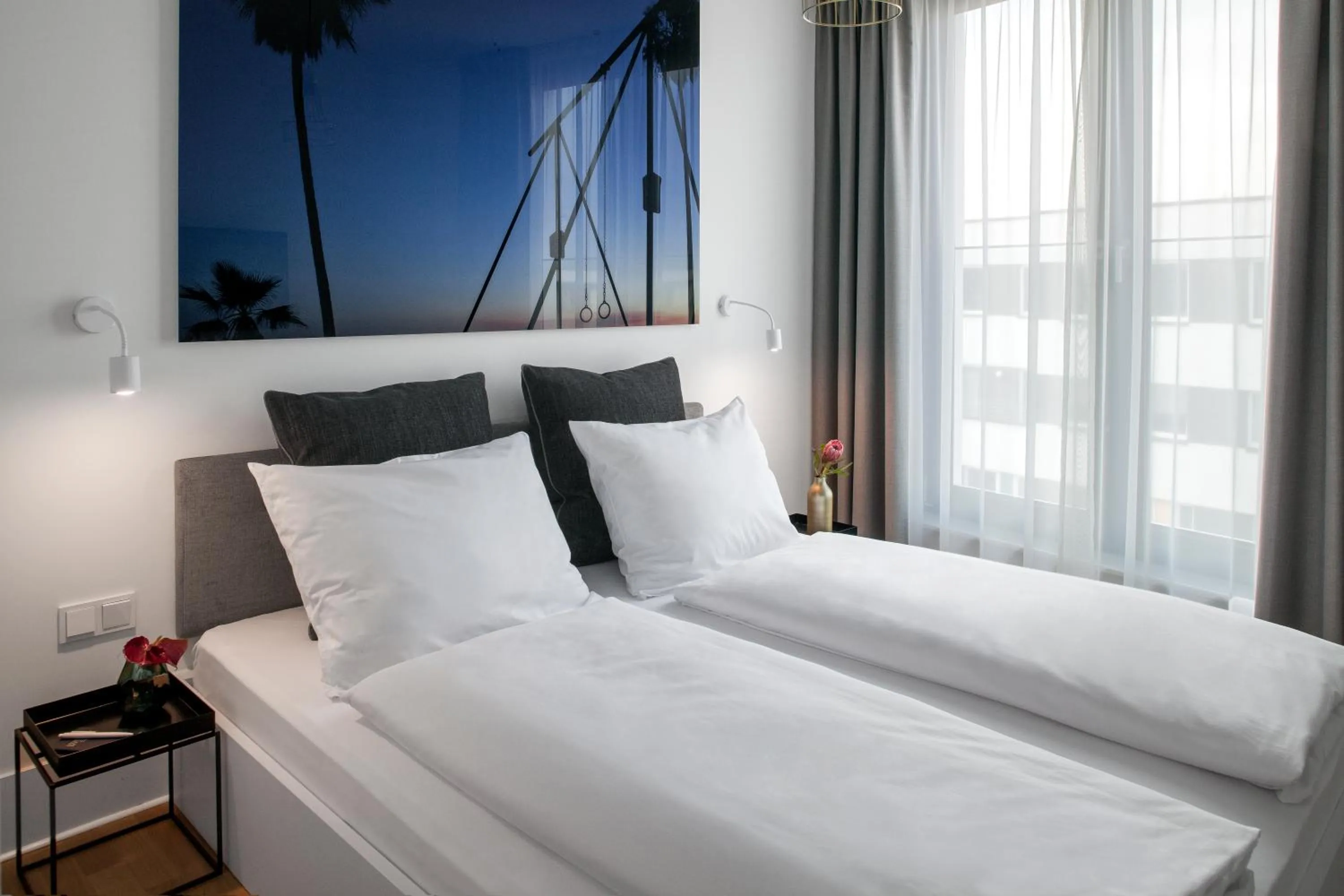 Bed in AMANO HOME Apartments