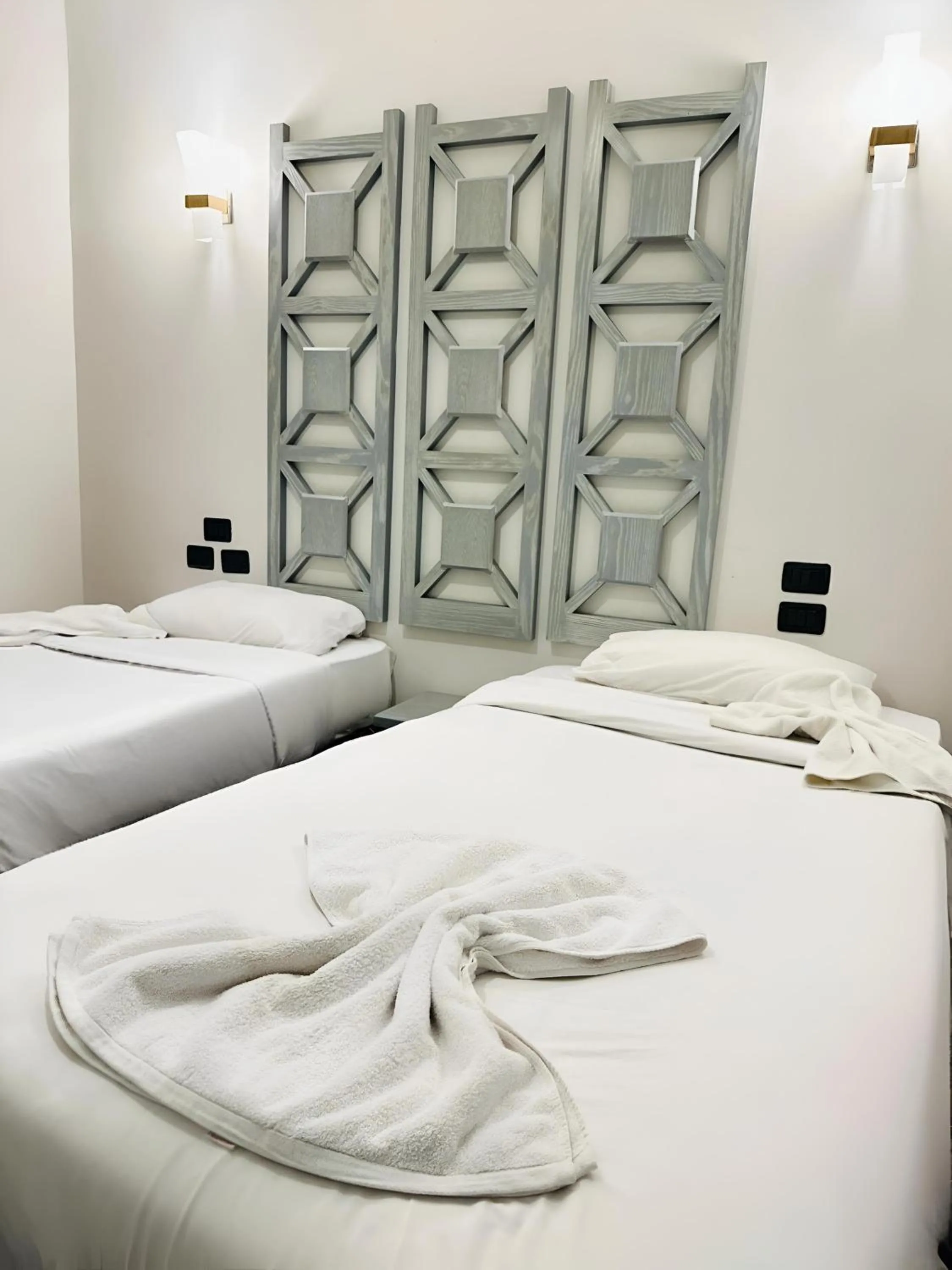 Bed in Royal Beach Serviced Apartments