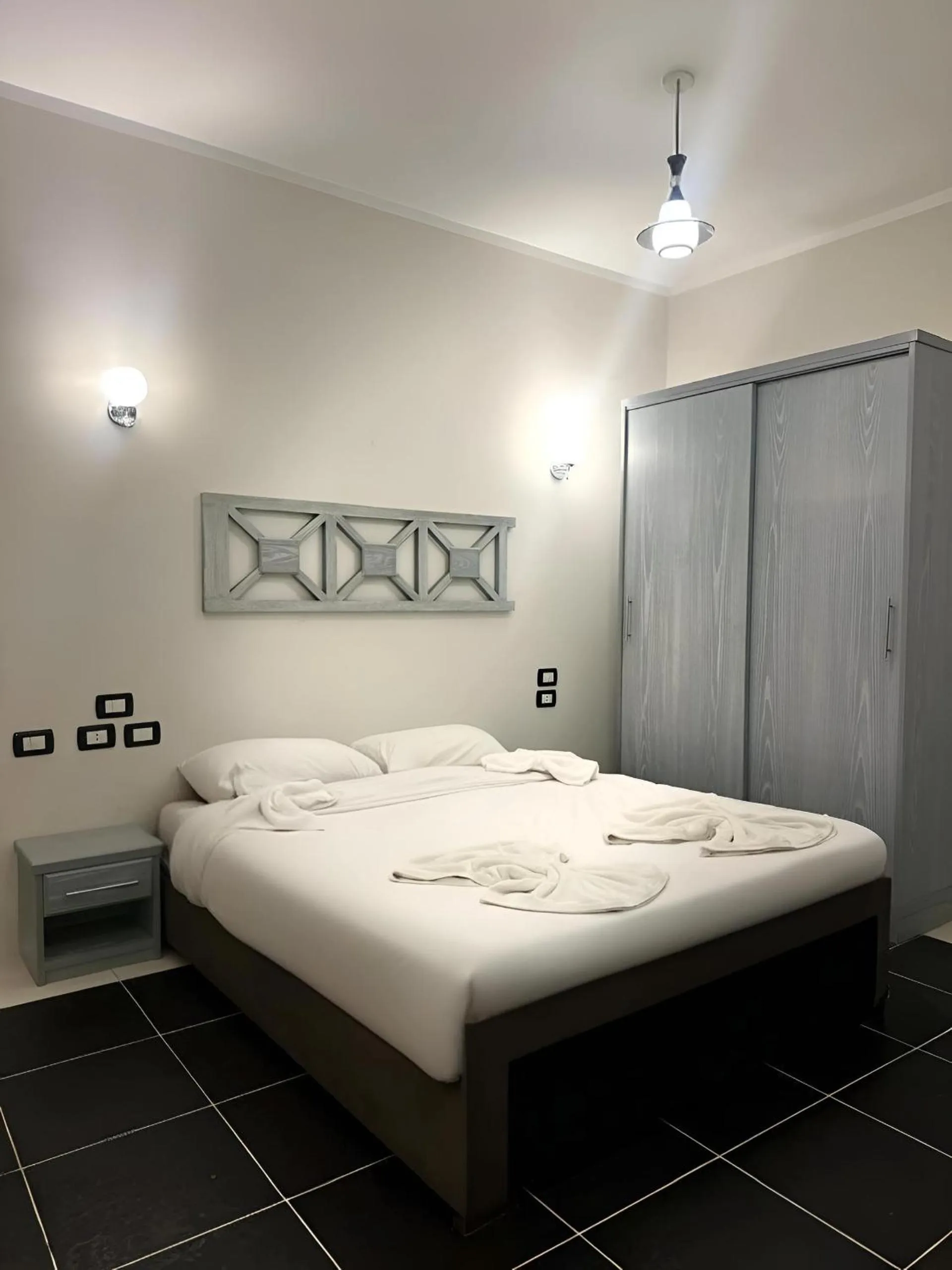 Bed in Royal Beach Serviced Apartments