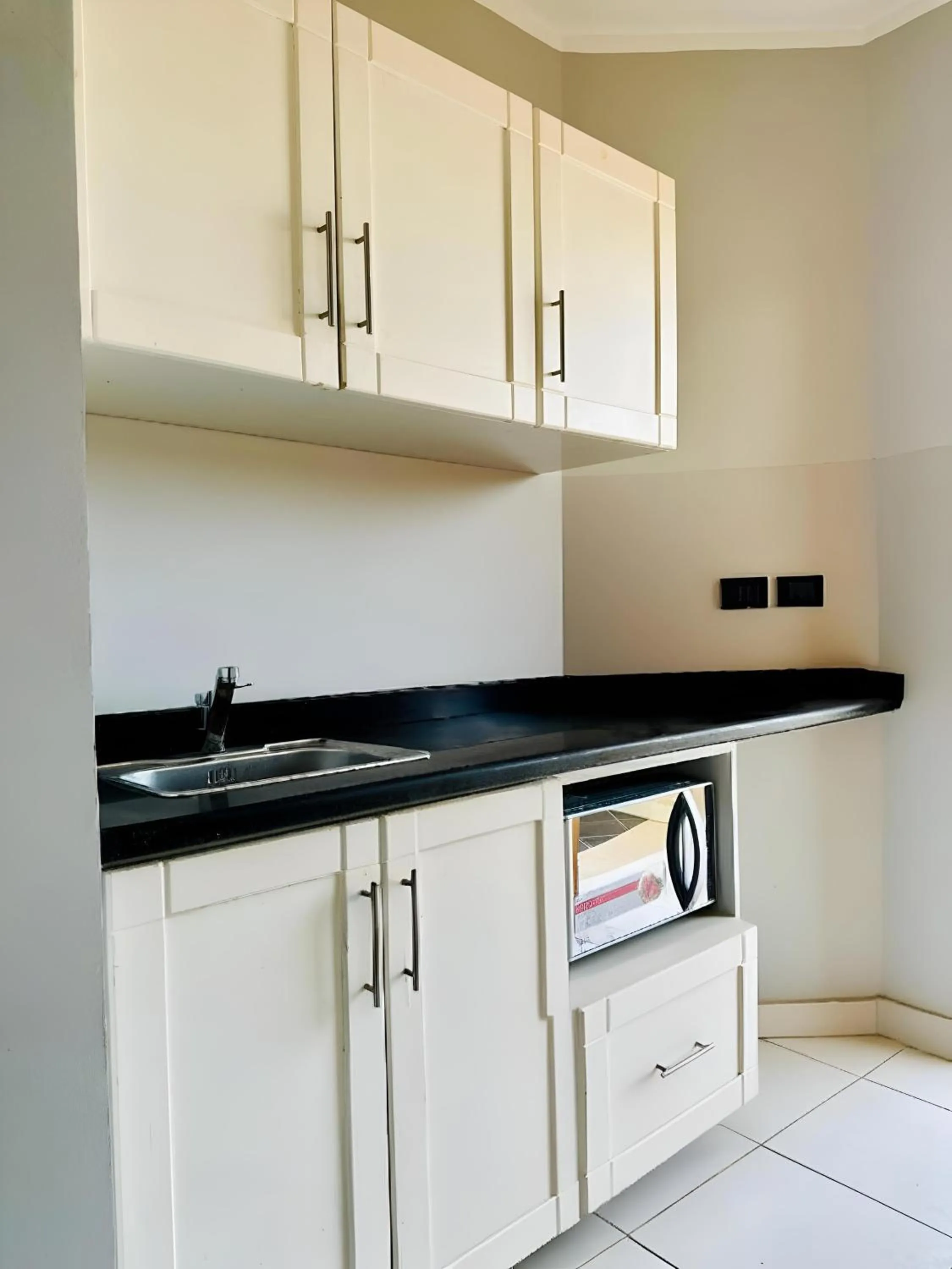 Kitchen or kitchenette in Royal Beach Serviced Apartments