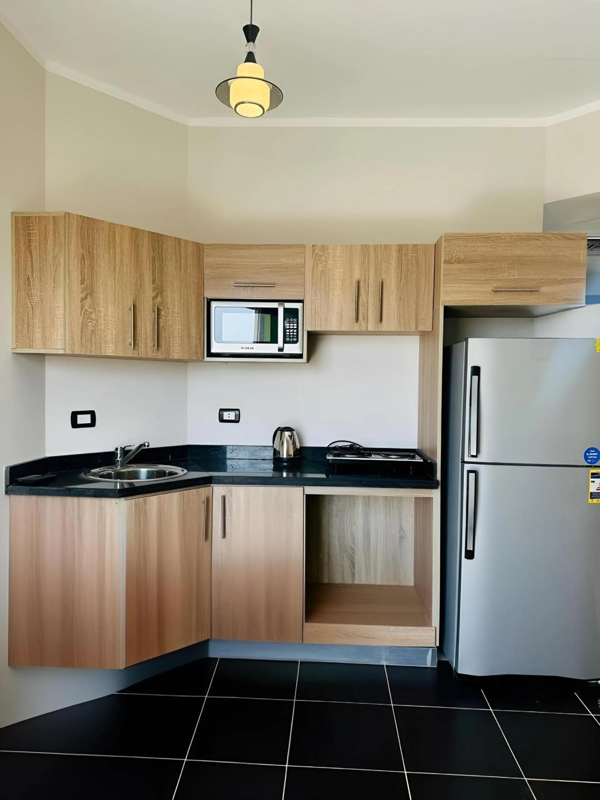 Kitchen or kitchenette in Royal Beach Serviced Apartments