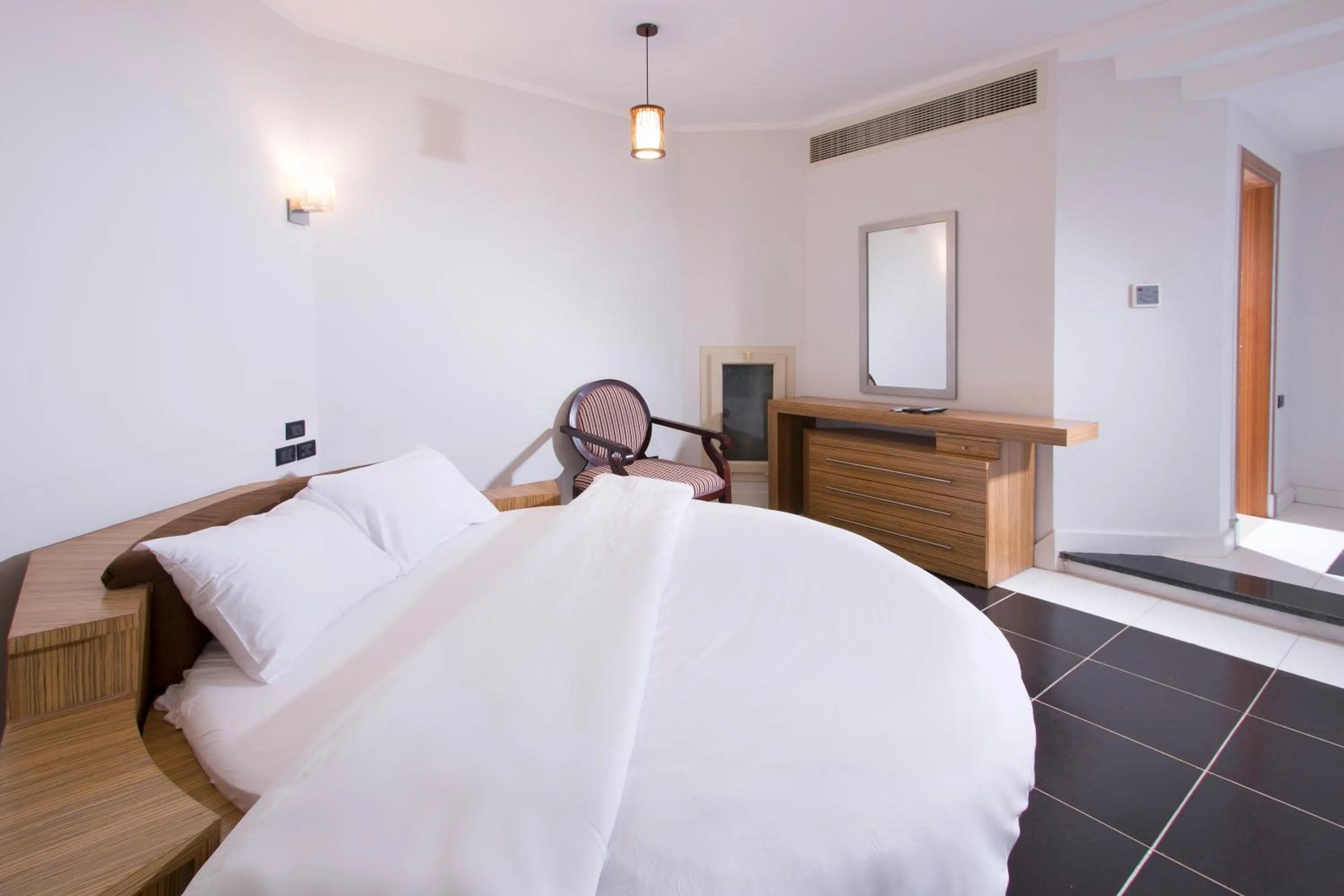 Bed in Royal Beach Serviced Apartments