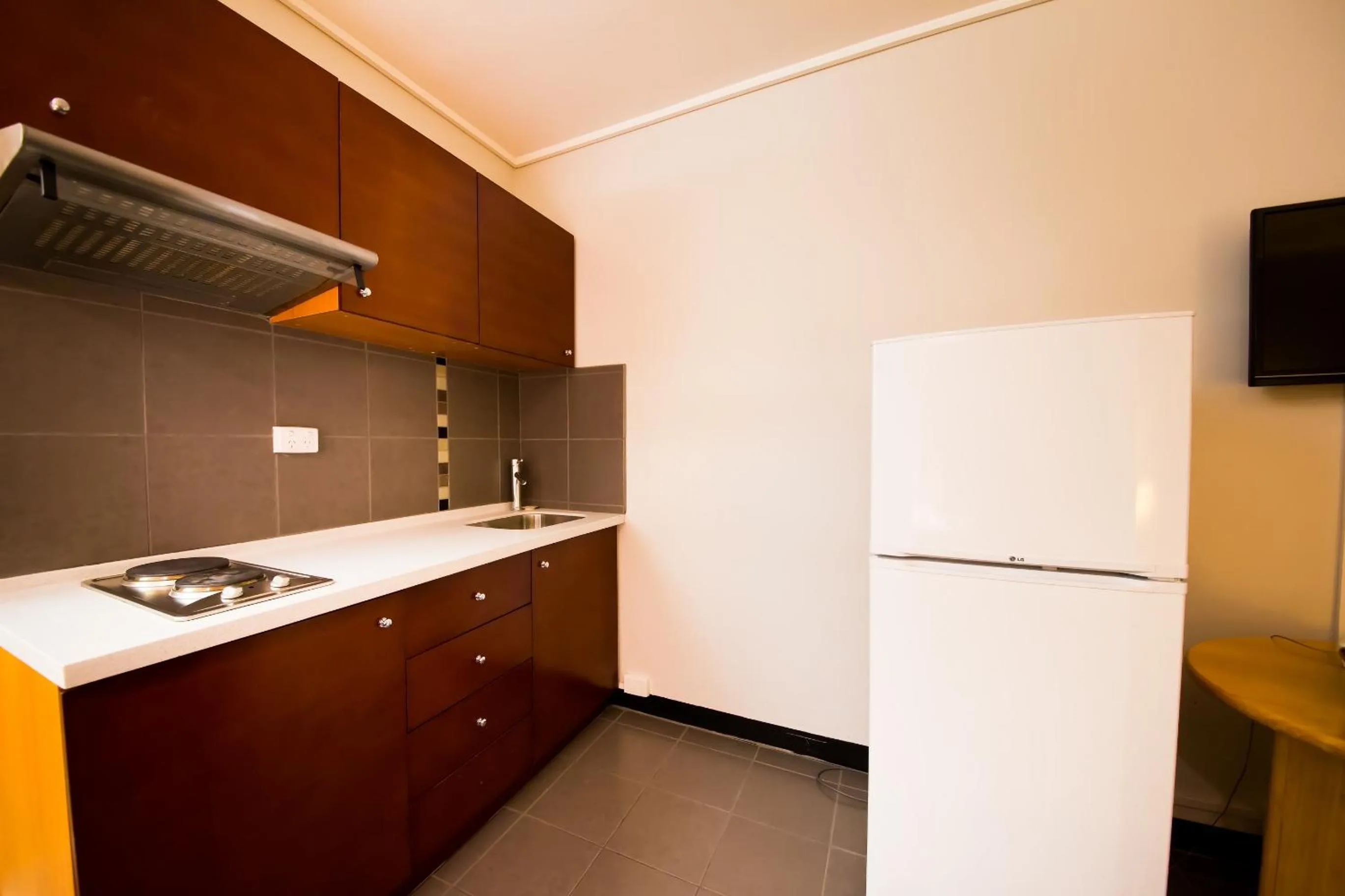 Kitchen or kitchenette in Sandown Regency Hotel & Apartments