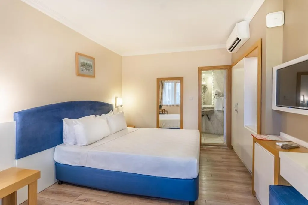 Bed in L'ancora Beach Hotel