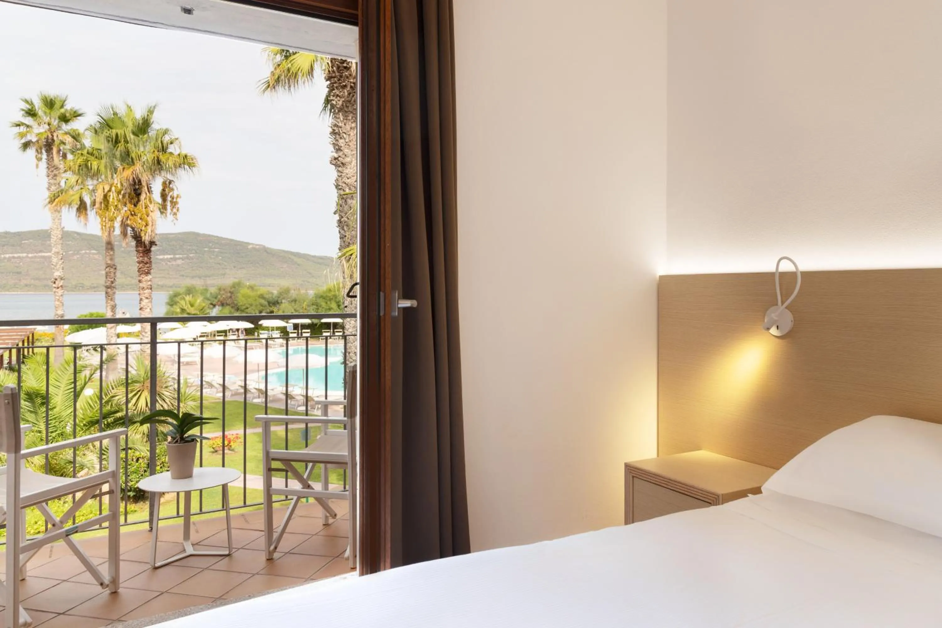 Balcony/Terrace, Bed in Hotel Corte Rosada Affiliated by Melia