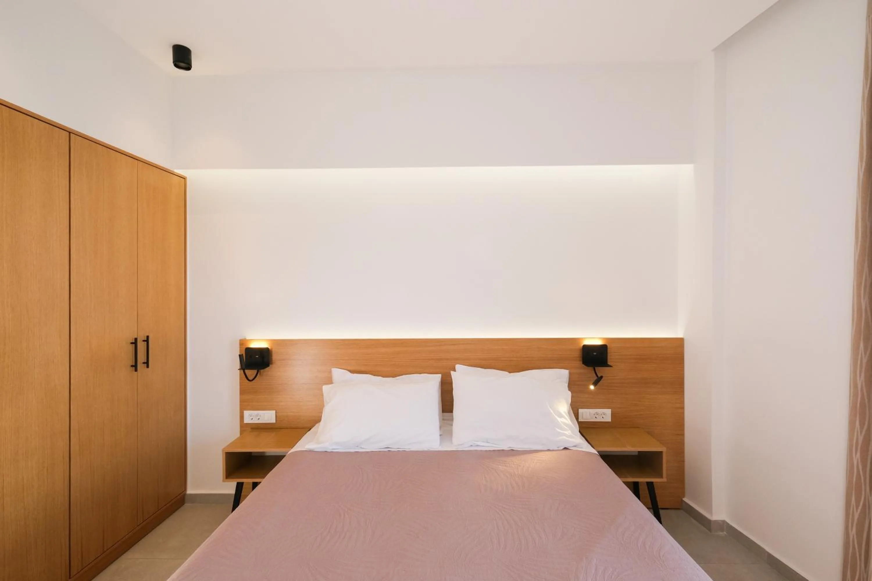 Bed in Arocaria Apartments