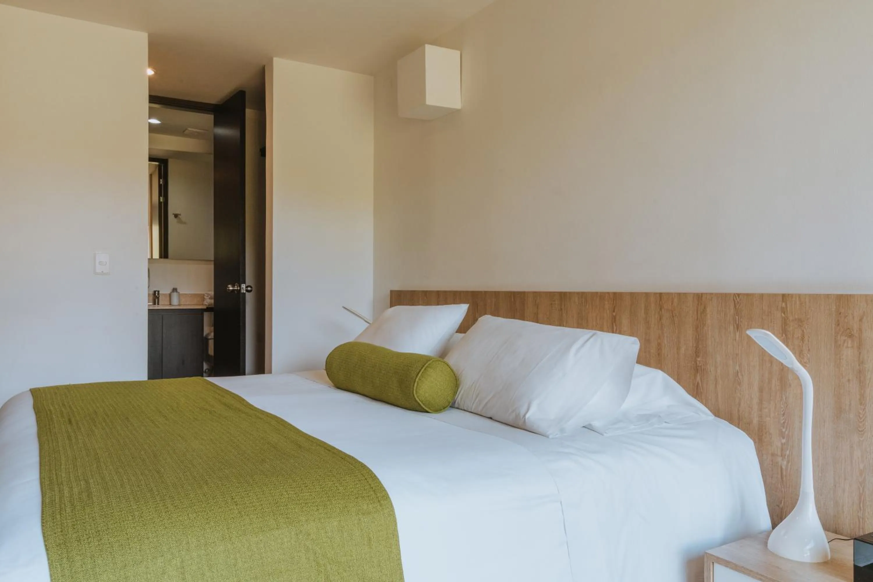 Bed in Travelers Rio Verde Living Suites