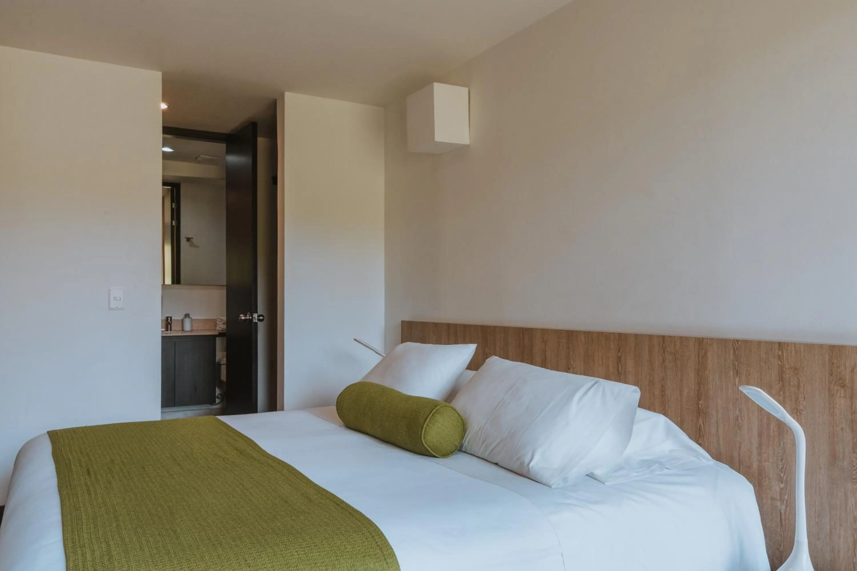 Bed in Travelers Rio Verde Living Suites