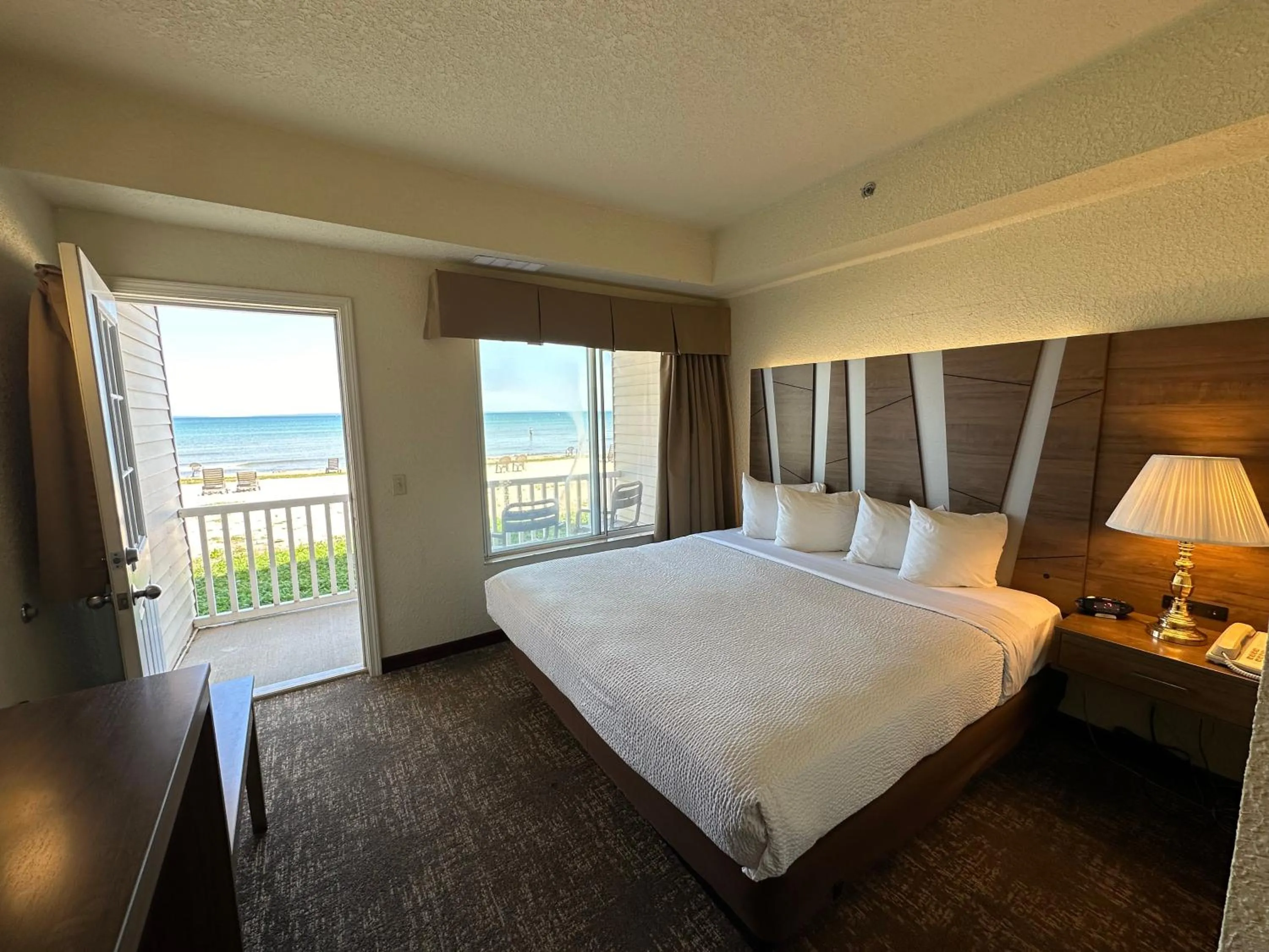 View (from property/room), Bed in Mackinaw Beach and Bay Inn & Suites