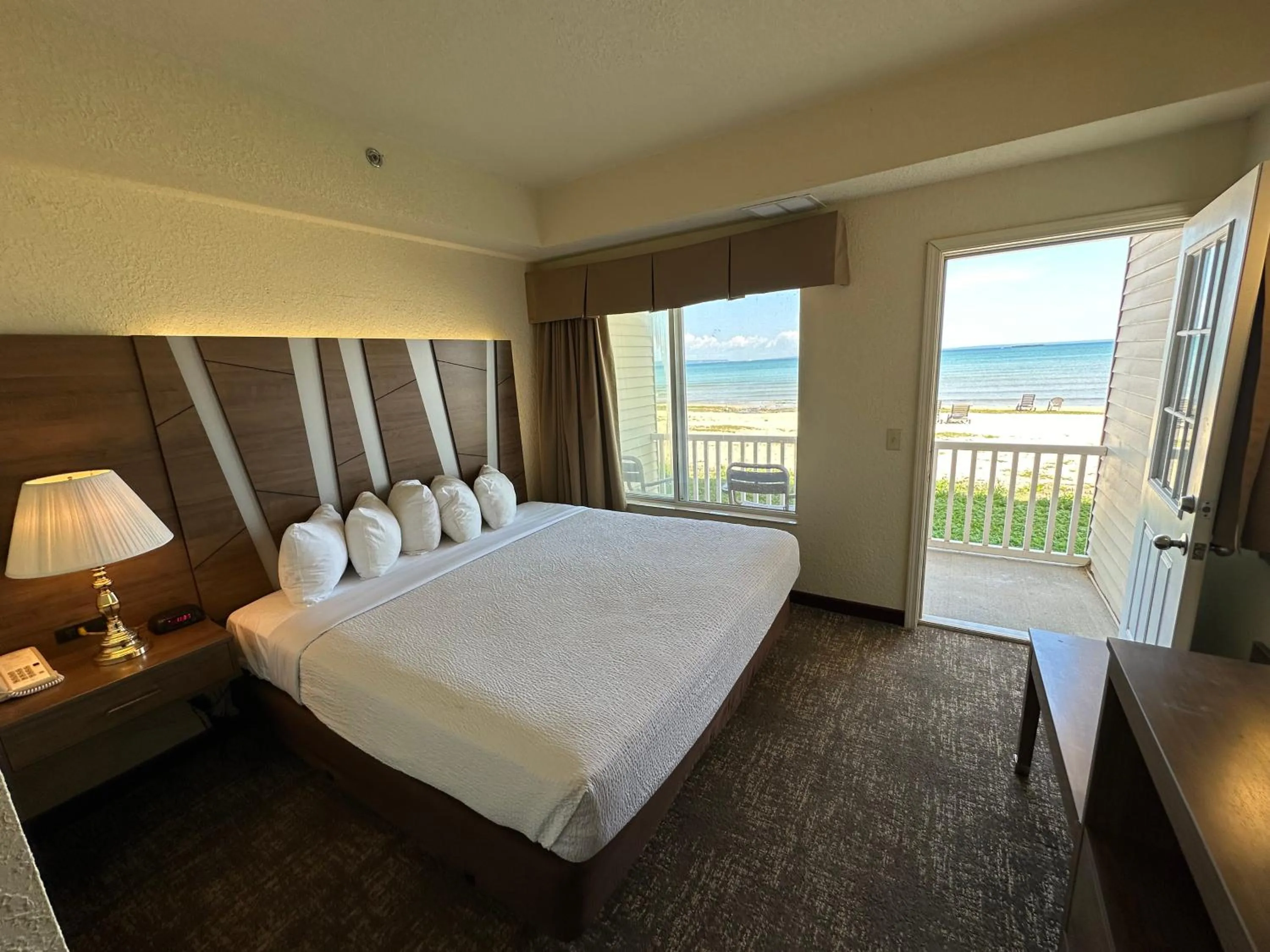 View (from property/room), Bed in Mackinaw Beach and Bay Inn & Suites