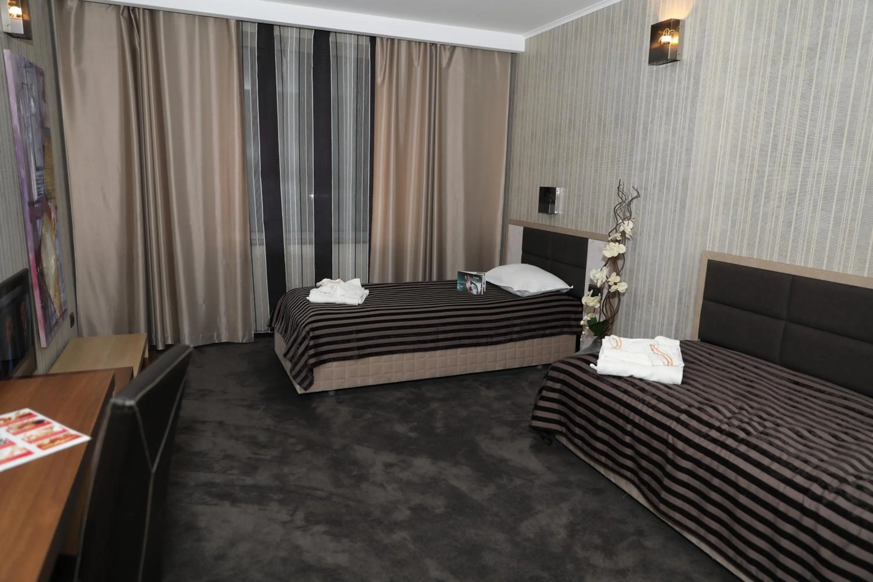 Bed in Cosmopolitan Hotel & Wellness