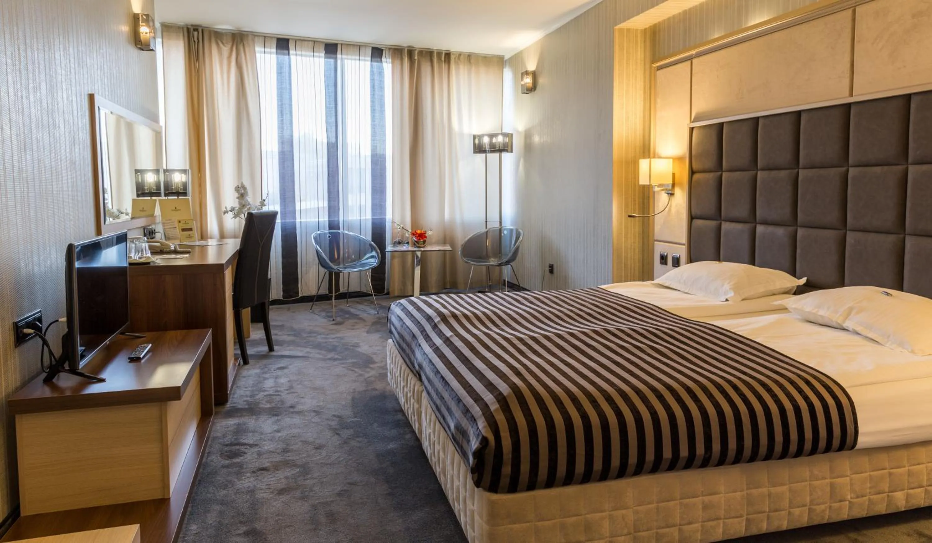 Bed in Cosmopolitan Hotel & Wellness