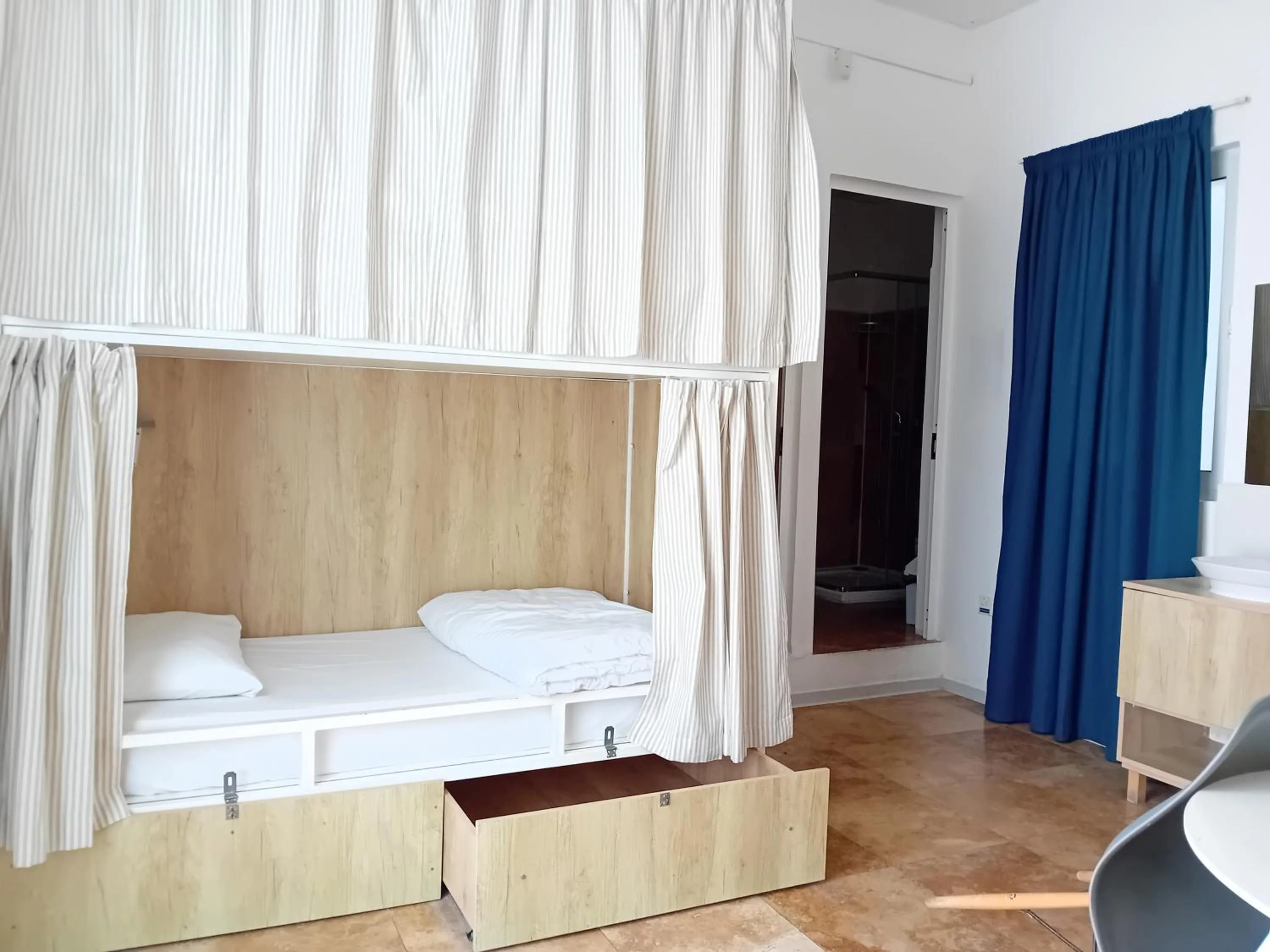 Photo of the whole room, Bed in Follow the Sun Boutique Hostel - Pool, Breakfast & Sea Views