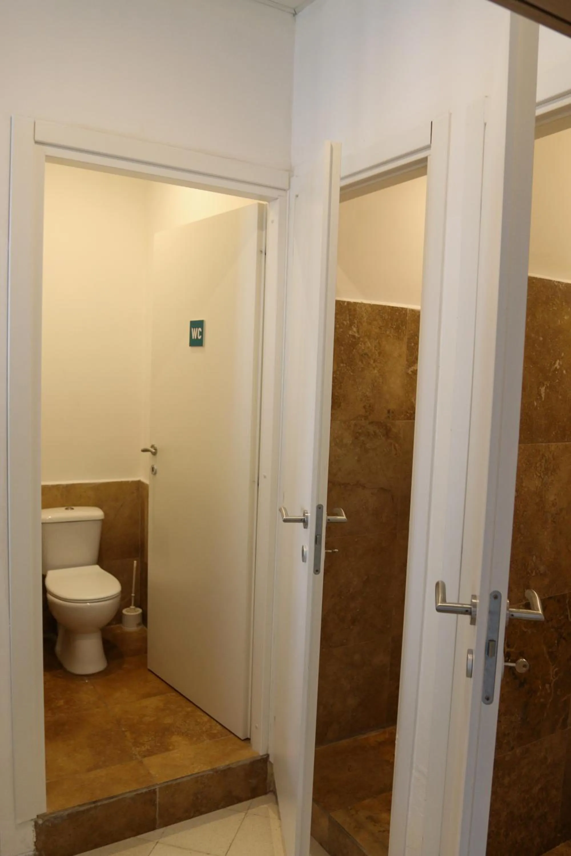 Toilet in Follow the Sun Boutique Hostel - Pool, Breakfast & Sea Views