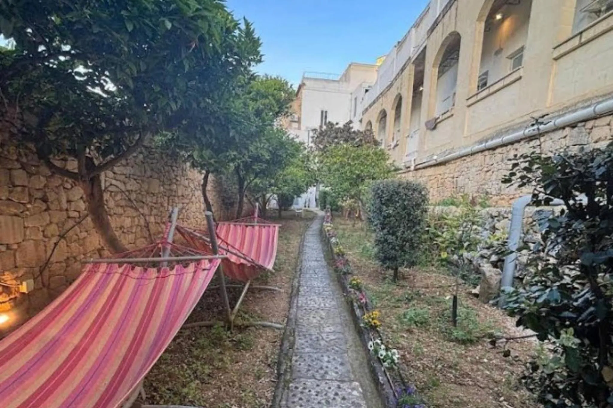 Garden view in Follow the Sun Boutique Hostel - Pool, Breakfast & Sea Views