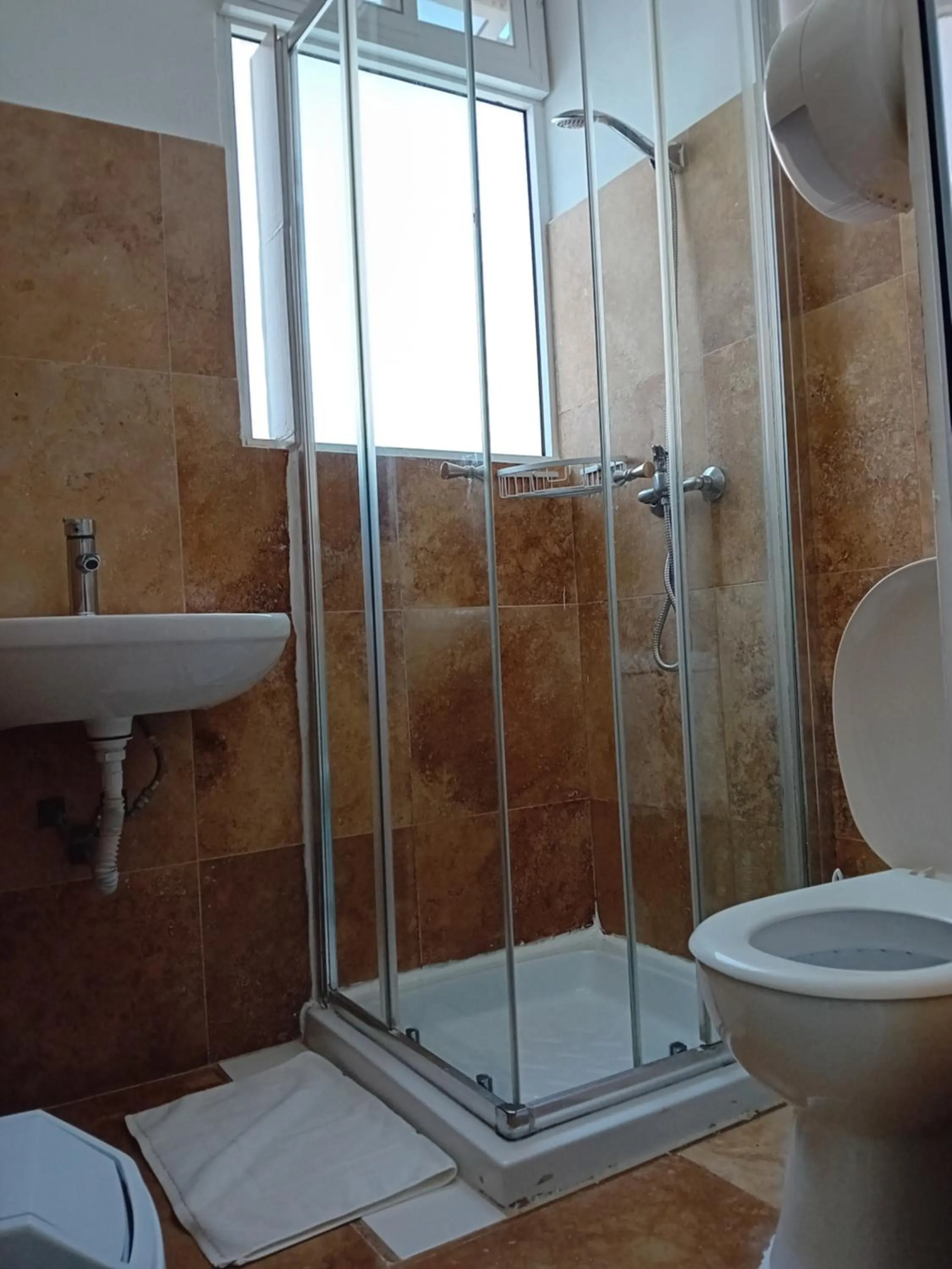 Shower in Follow the Sun Boutique Hostel - Pool, Breakfast & Sea Views