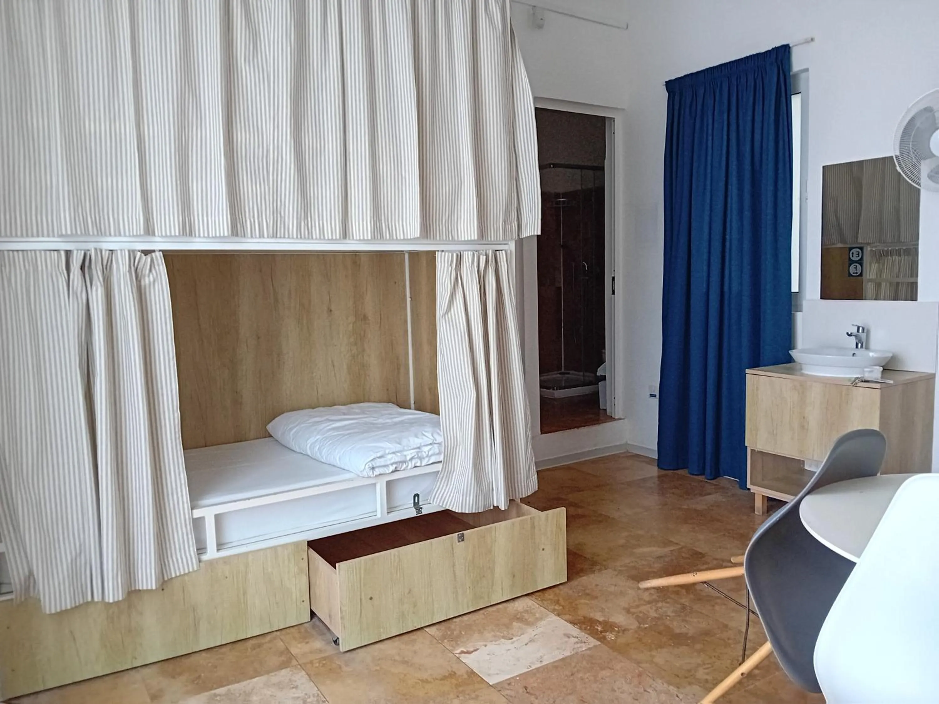 Photo of the whole room, Bed in Follow the Sun Boutique Hostel - Pool, Breakfast & Sea Views