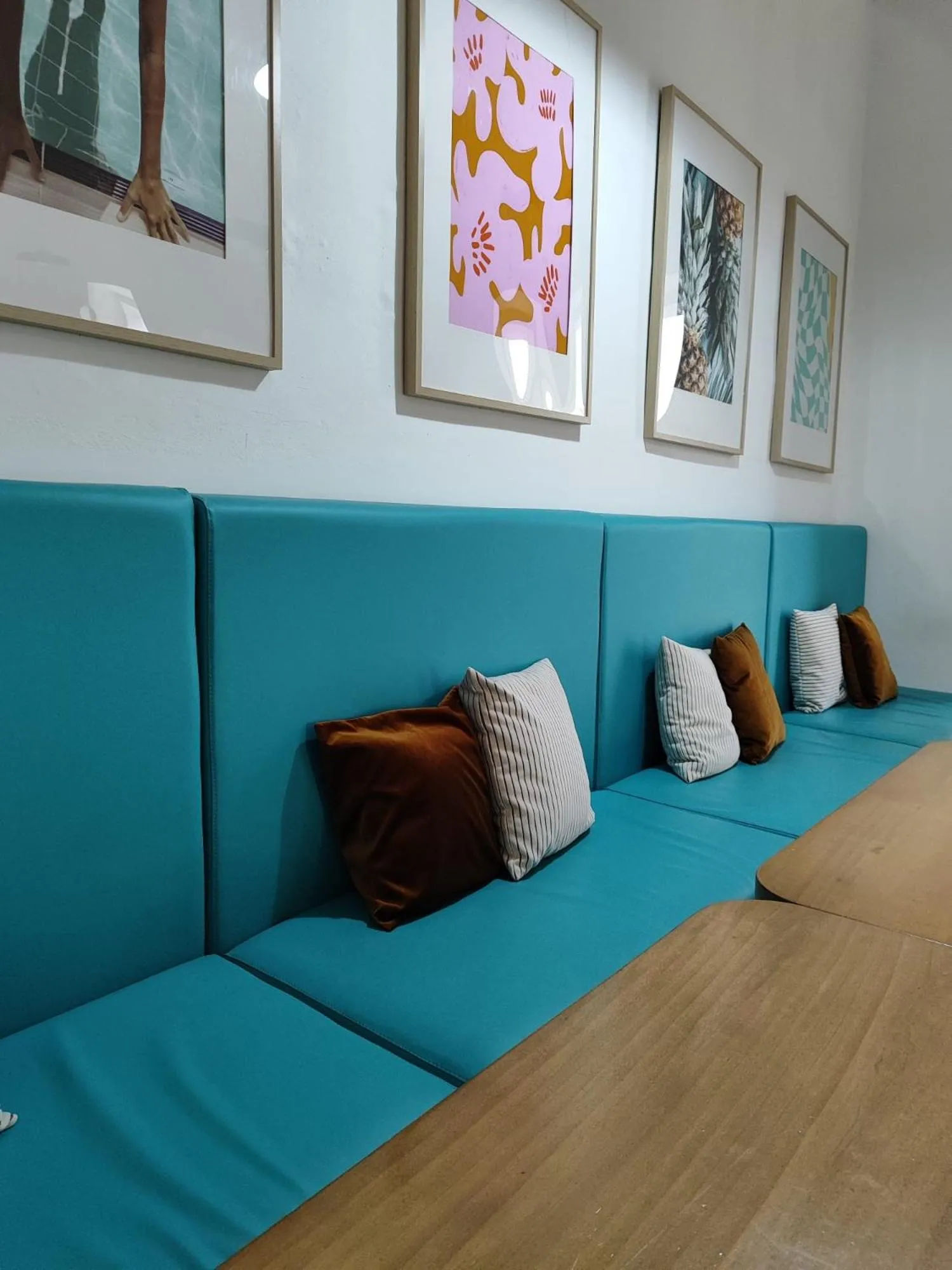 Communal lounge/ TV room in Follow the Sun Boutique Hostel - Pool, Breakfast & Sea Views