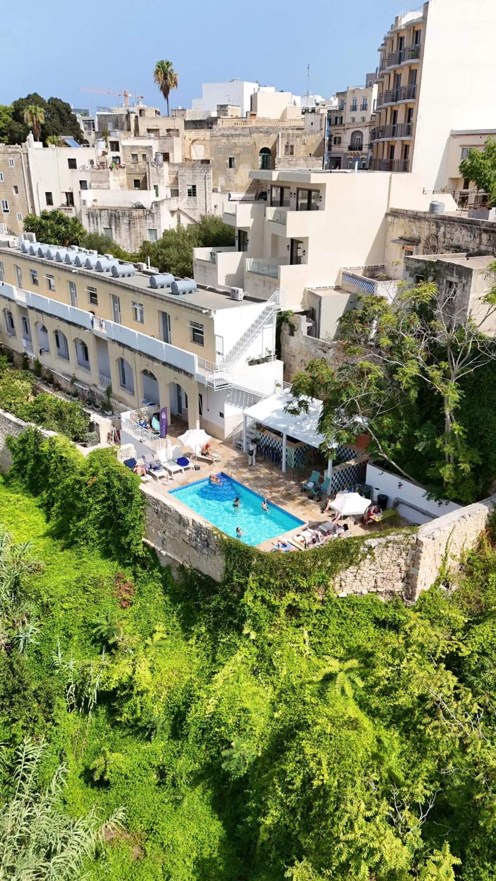 Property building in Follow the Sun Boutique Hostel - Pool, Breakfast & Sea Views