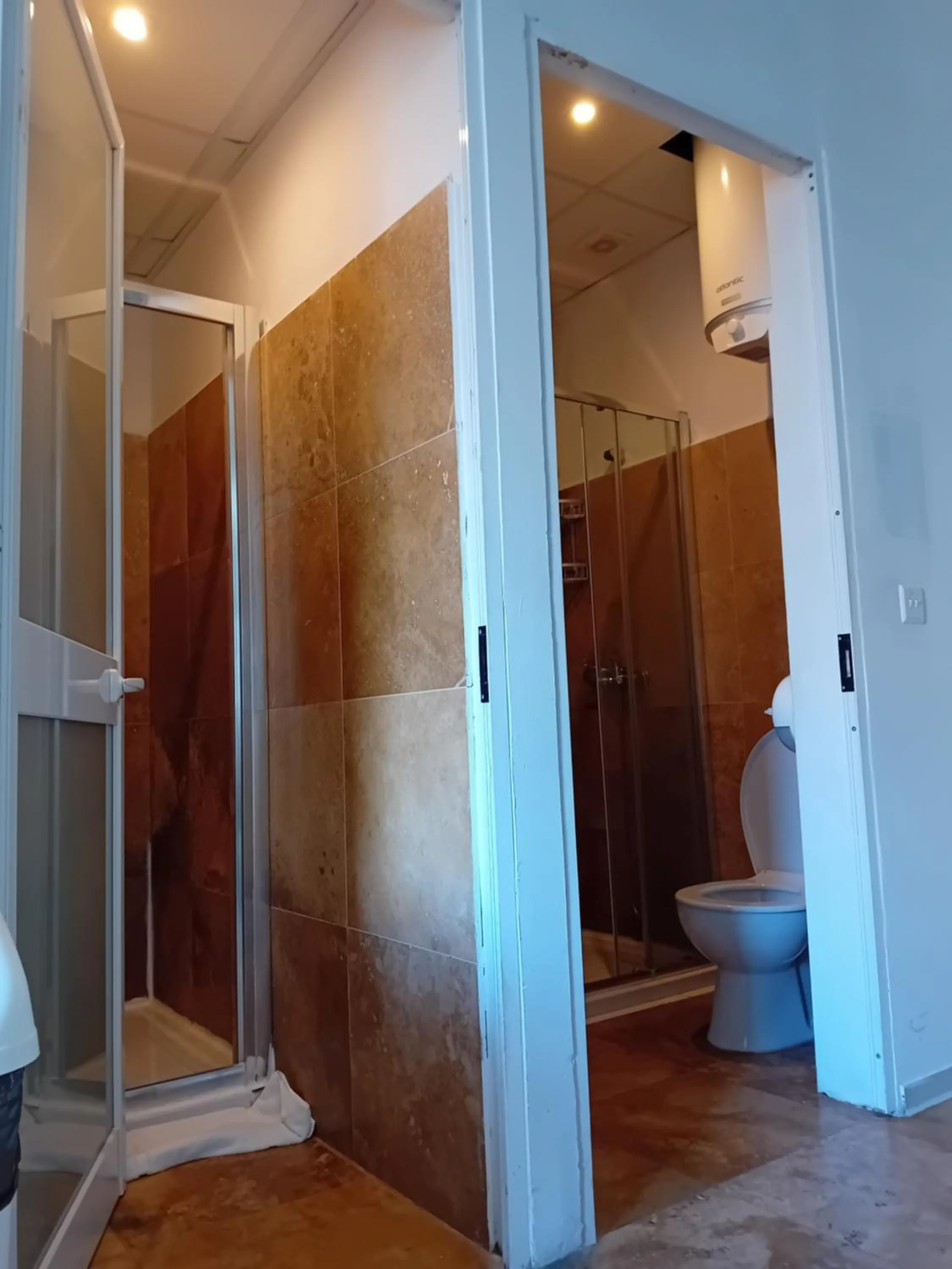 Bathroom in Follow the Sun Boutique Hostel - Pool, Breakfast & Sea Views