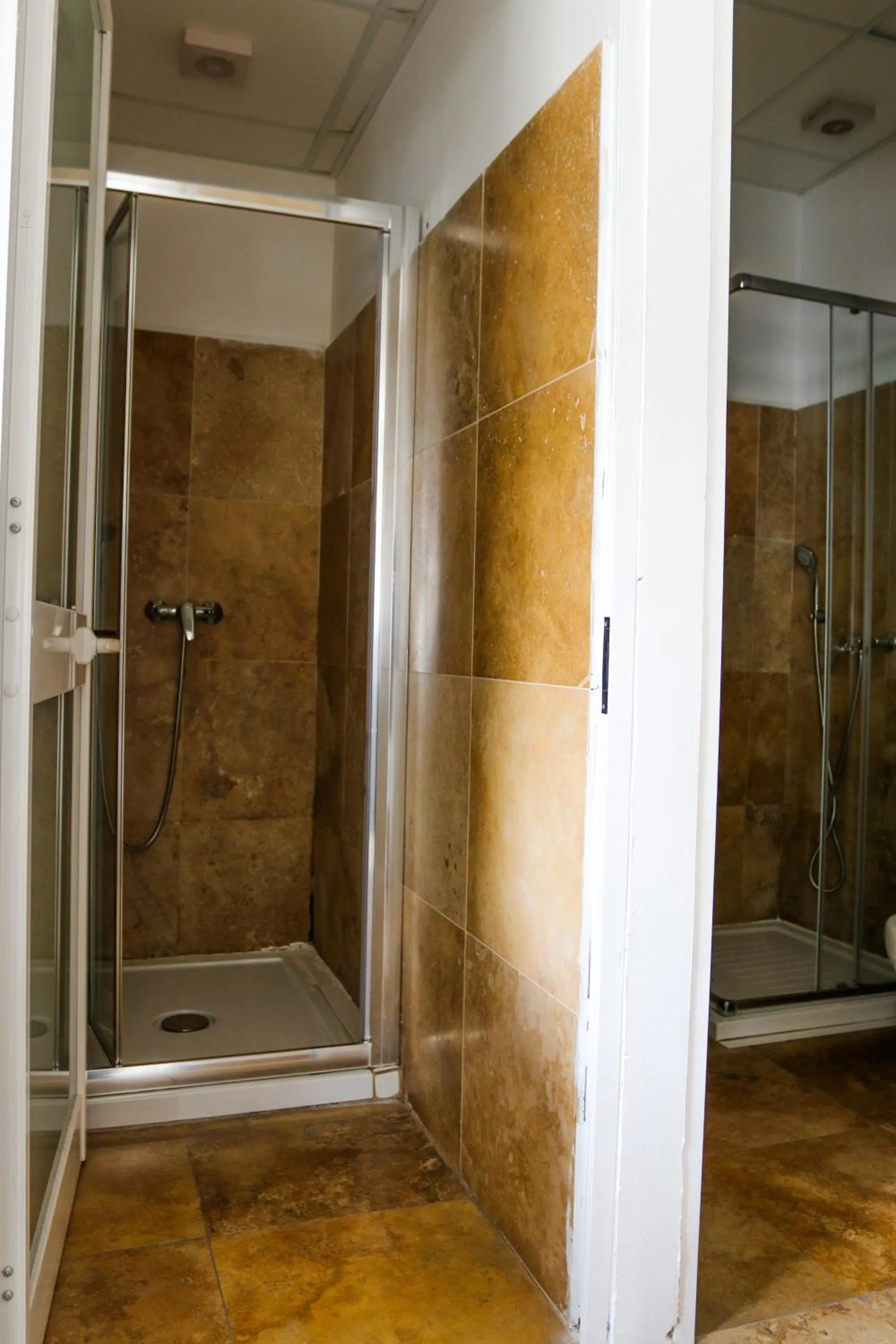 Shower in Follow the Sun Boutique Hostel - Pool, Breakfast & Sea Views
