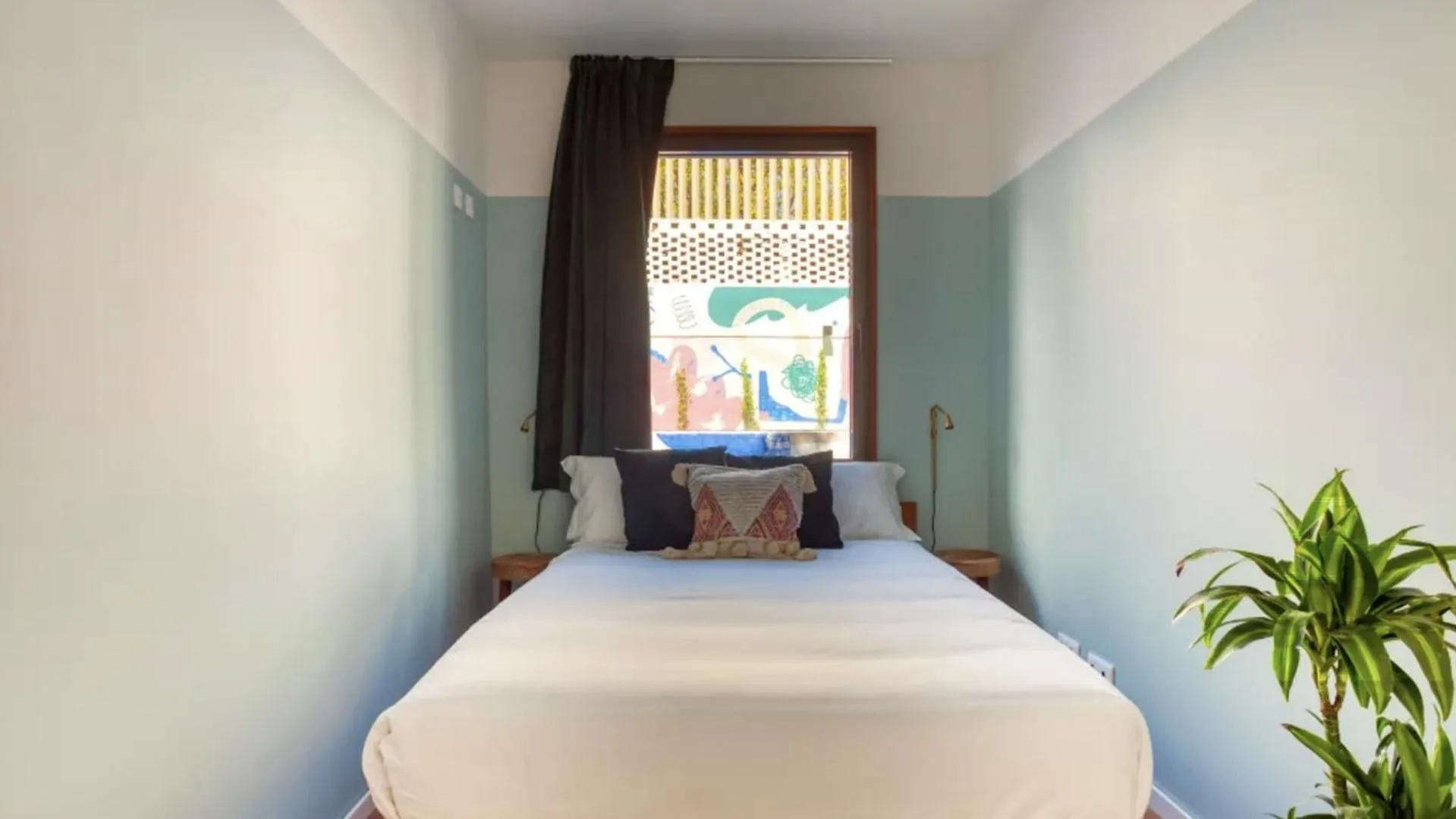 Bed in Selina Secret Garden Lisbon by IKIGAI Global Hospitality