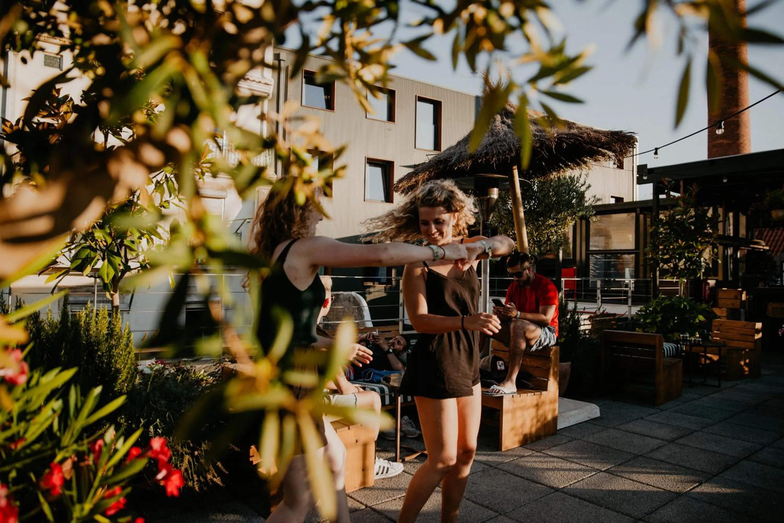 People in Selina Secret Garden Lisbon by IKIGAI Global Hospitality