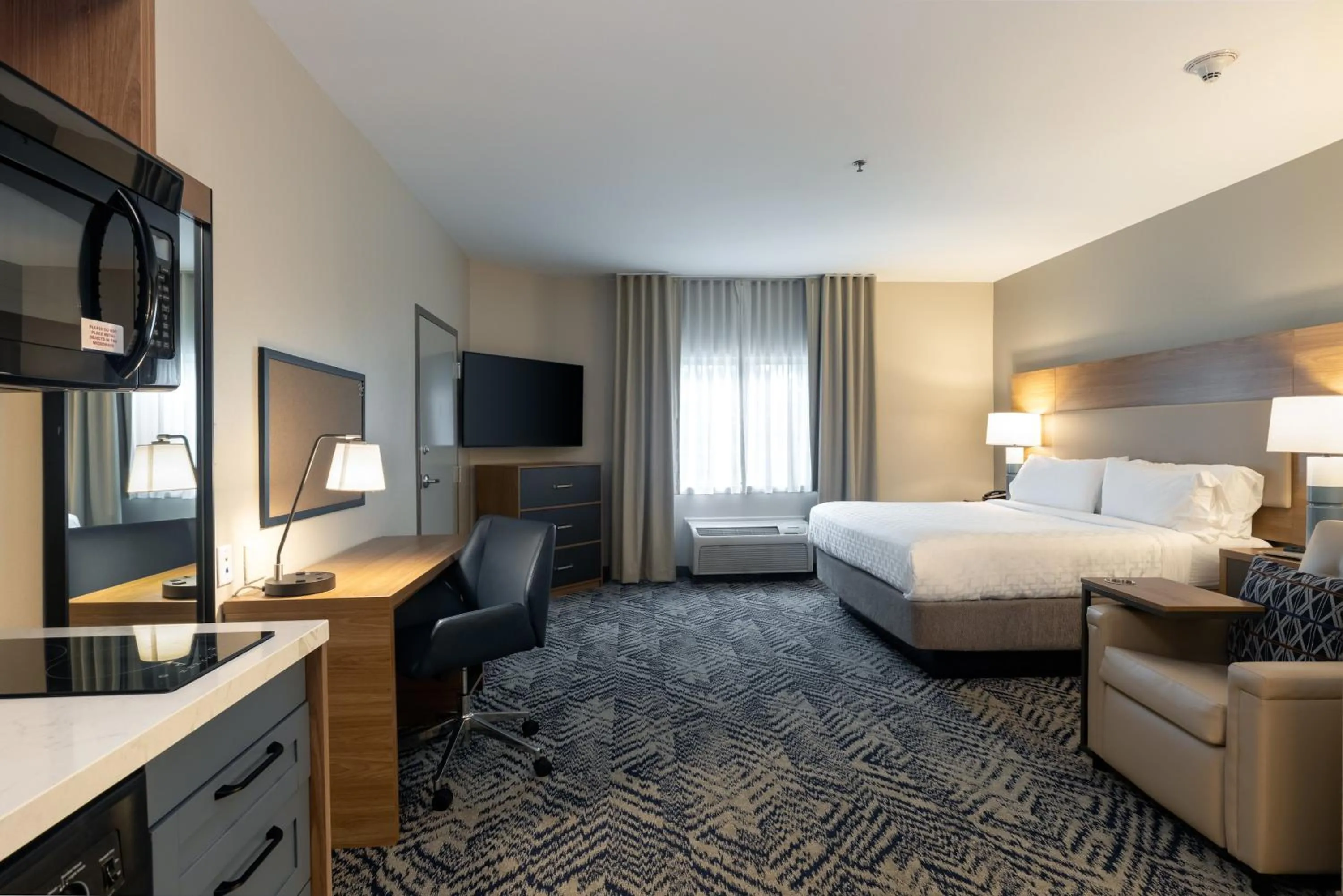 Photo of the whole room, Bed in Candlewood Suites Enterprise by IHG