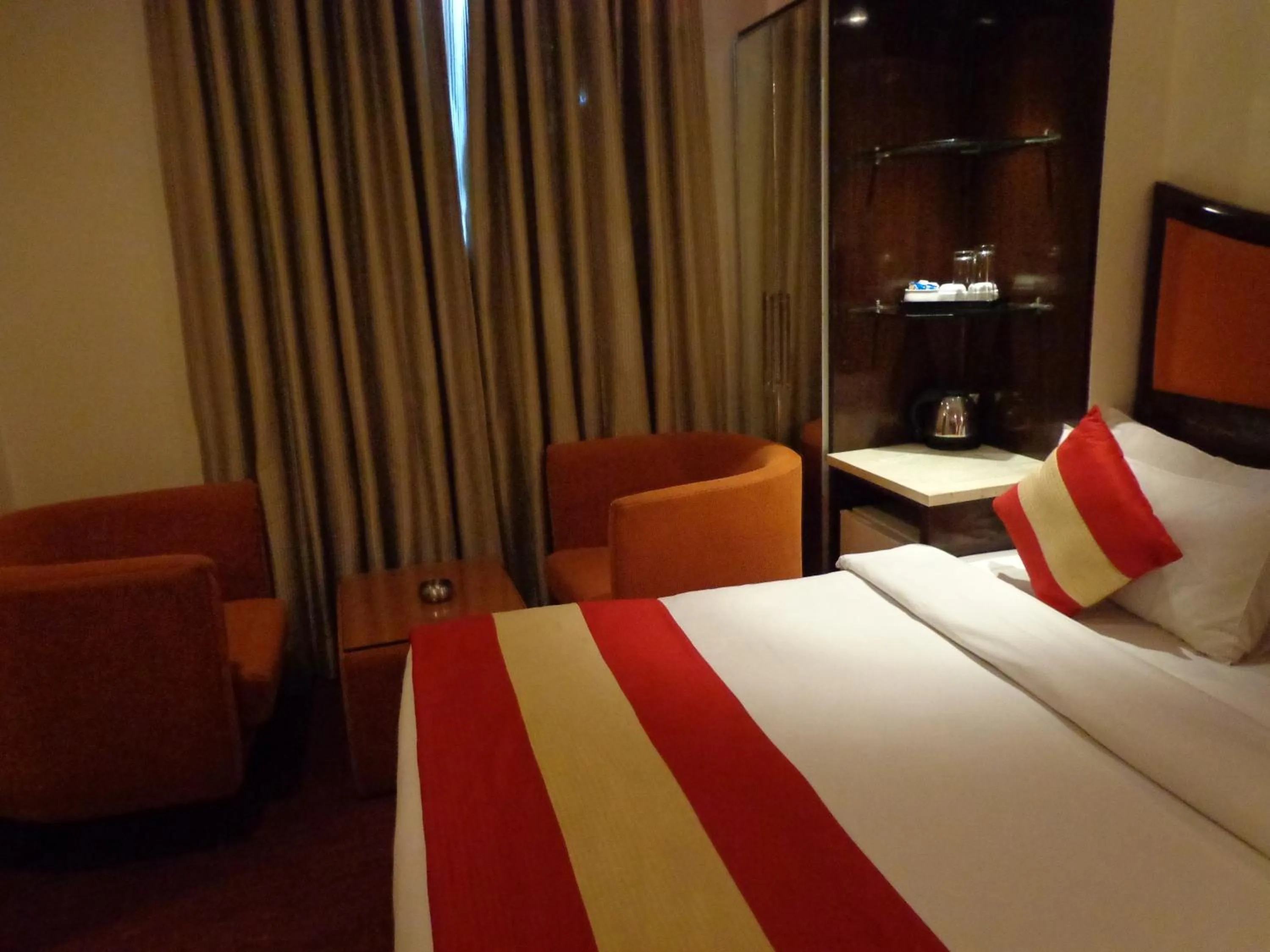 Seating area, Bed in Hotel Aura Near Connaught Place
